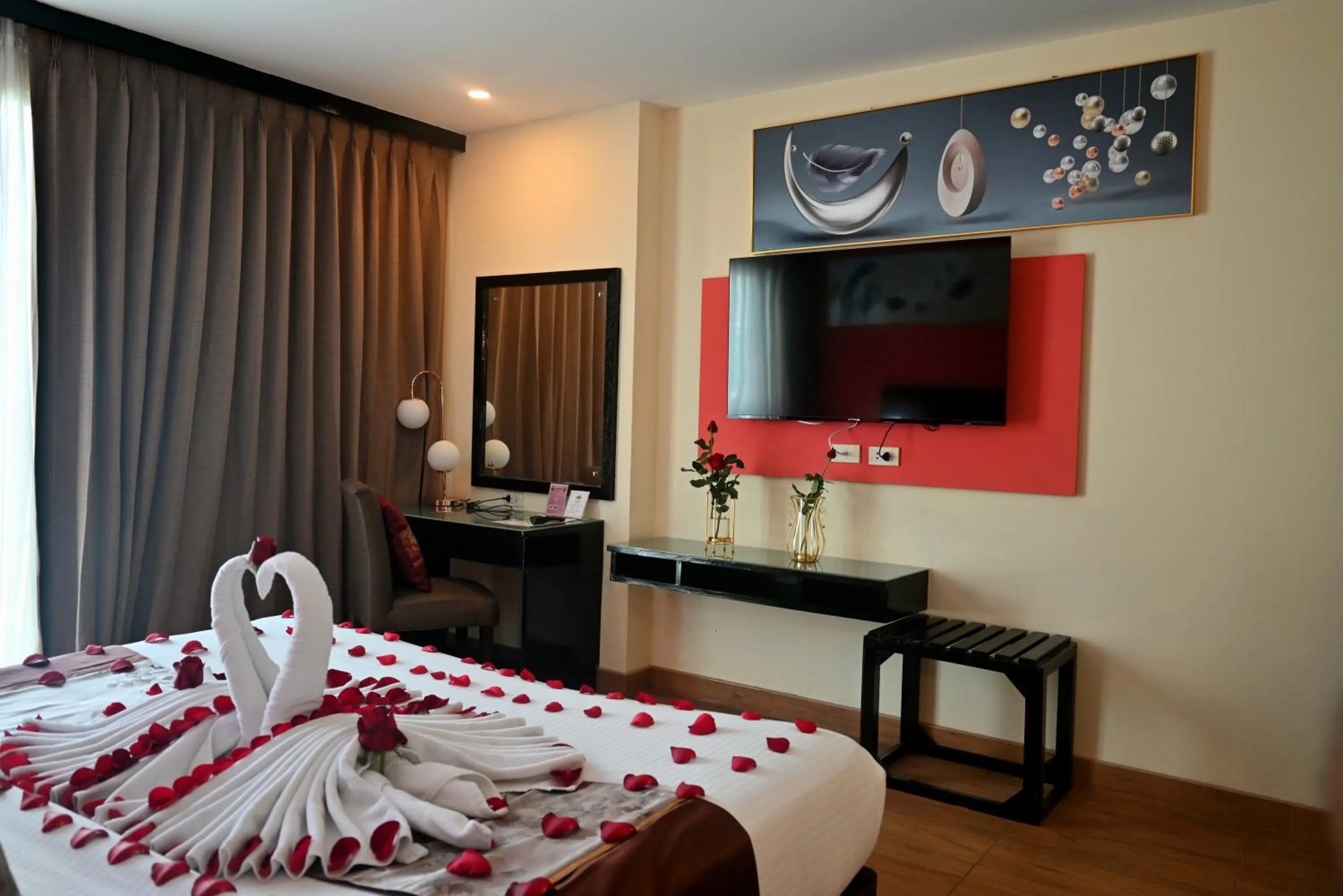 Bed in Boss Suites Nana Hotel