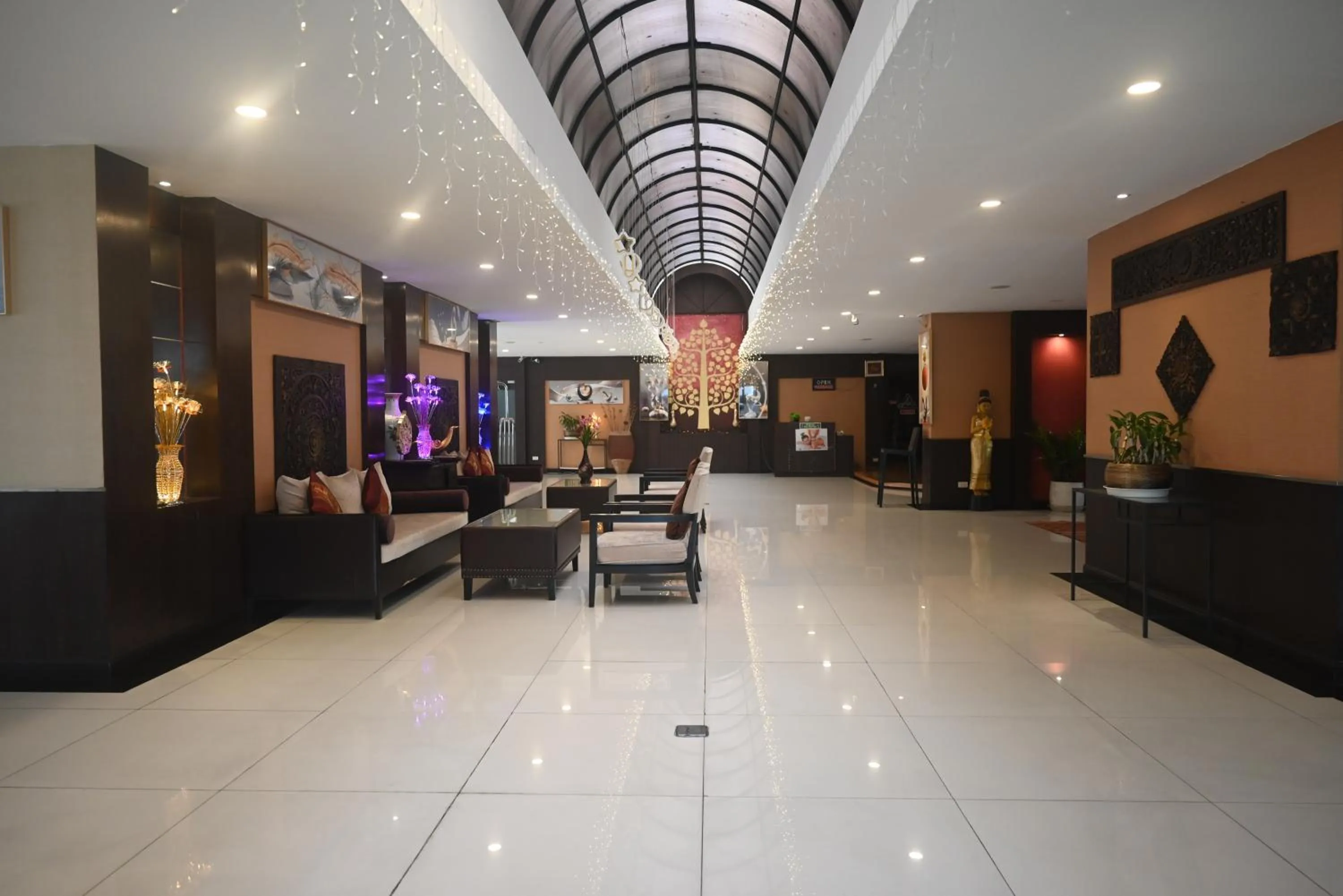 Seating area in Boss Suites Nana Hotel