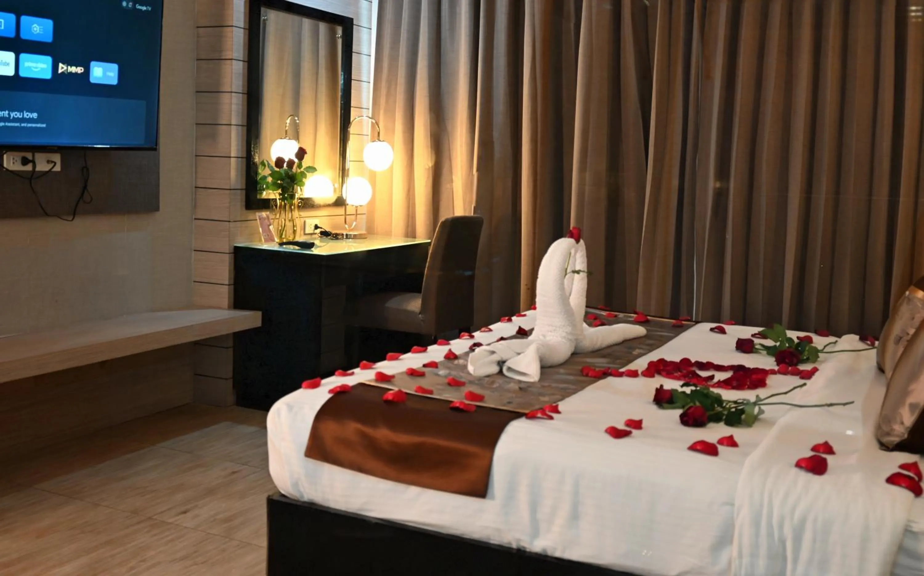 Bed in Boss Suites Nana Hotel