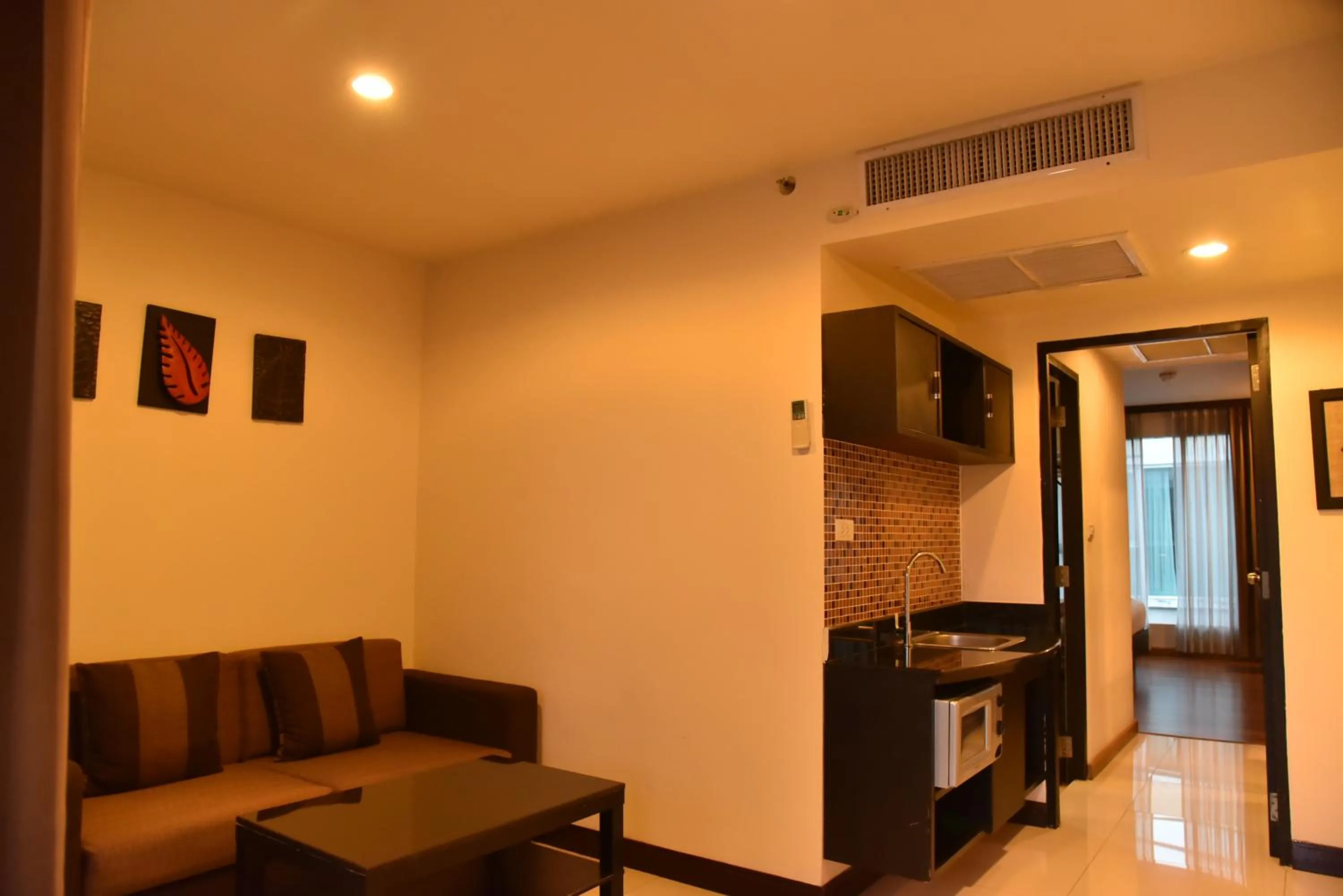 Living room in Boss Suites Nana Hotel