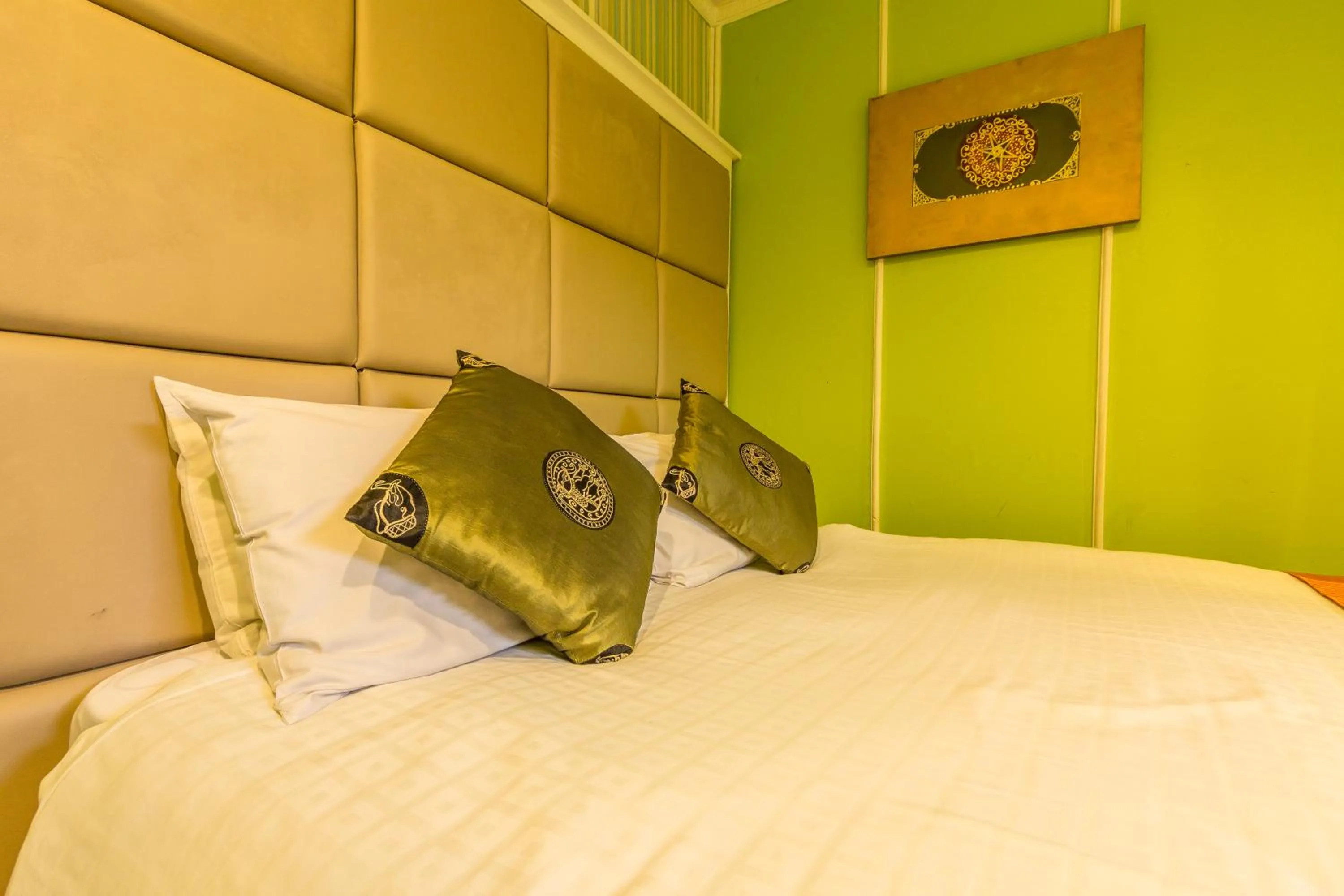 Bed, Seating Area in Sam's Lodge