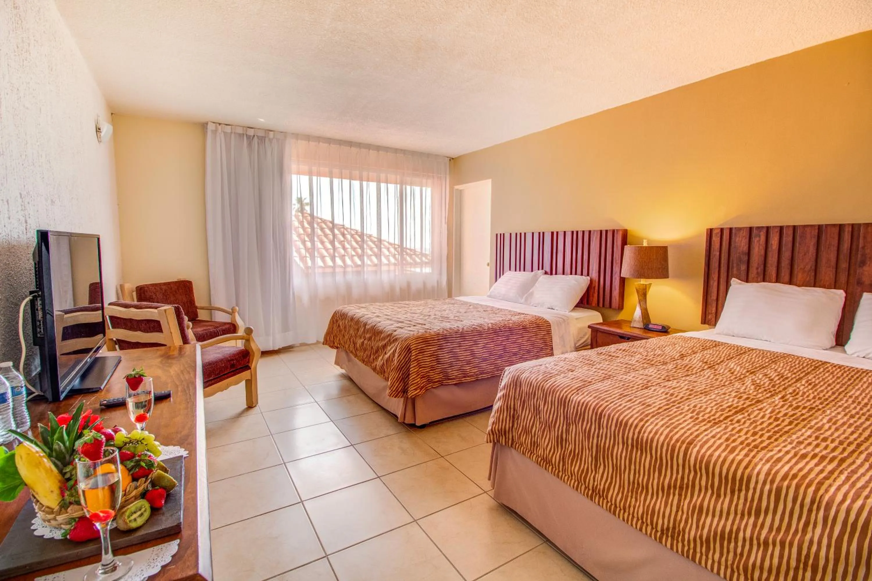 Bed in Puerto Nuevo Baja Hotel & Villas