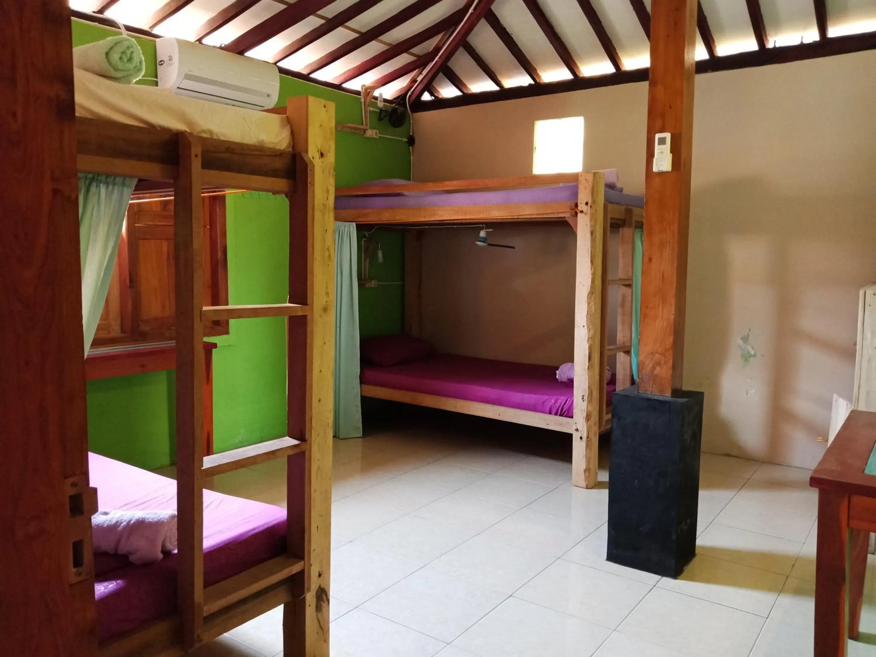 Bed in Arjuna Garden Homestay