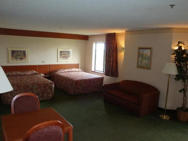 Bed in Syracuse Inn and Suites