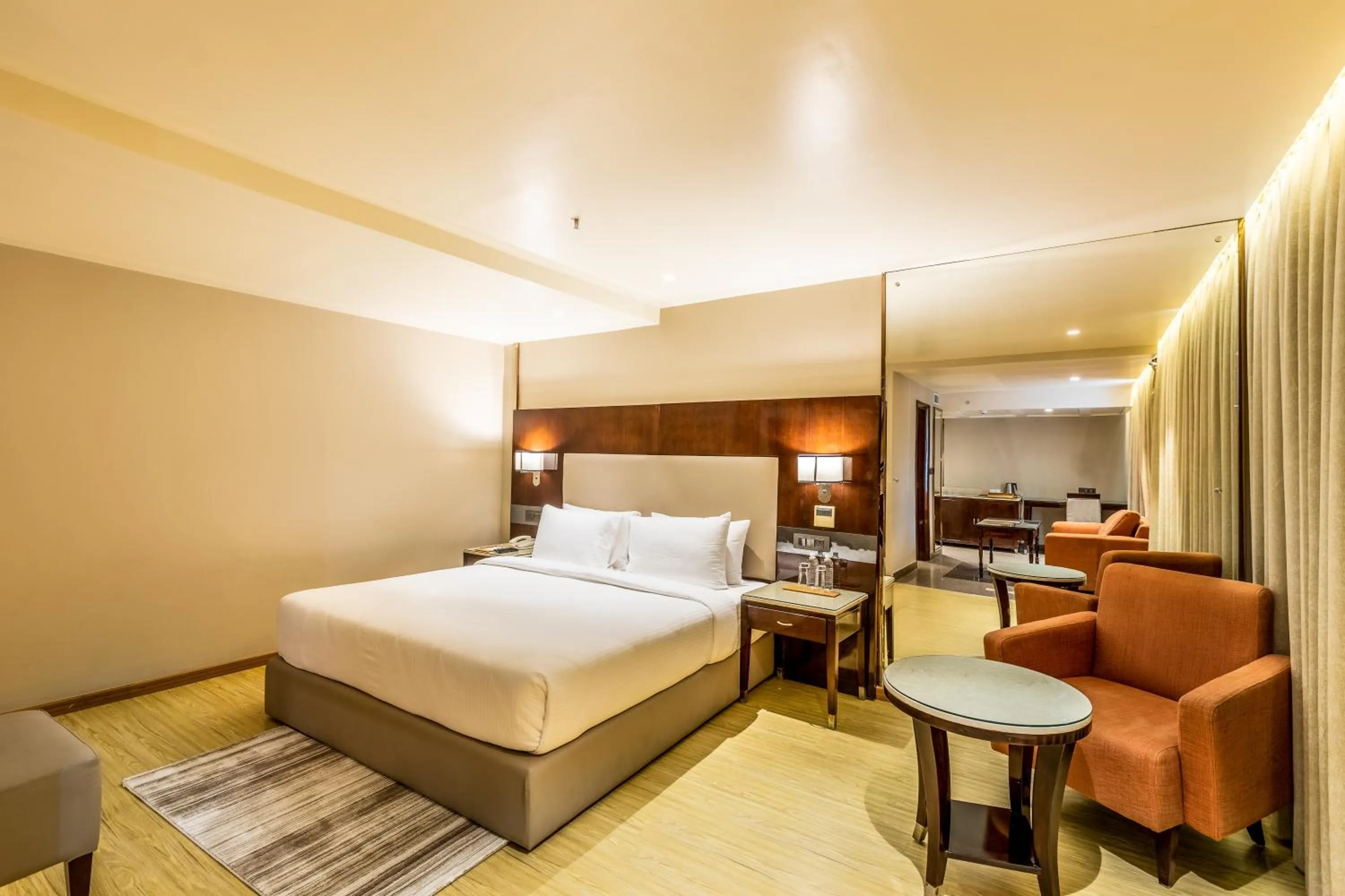 Bedroom, Bed in Citadel Sarovar Portico Bengaluru