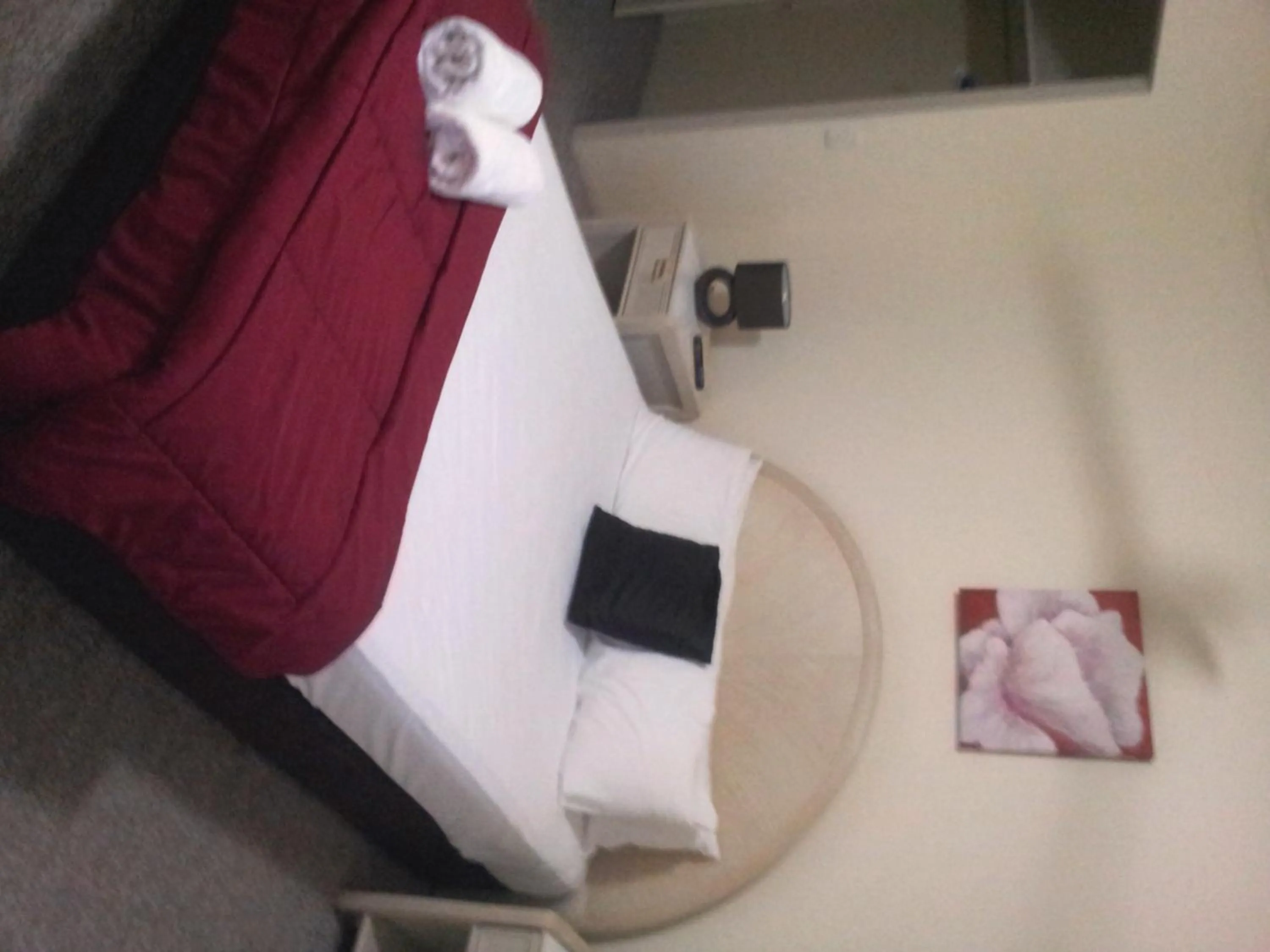 Bed in Champelli Palms Apartments