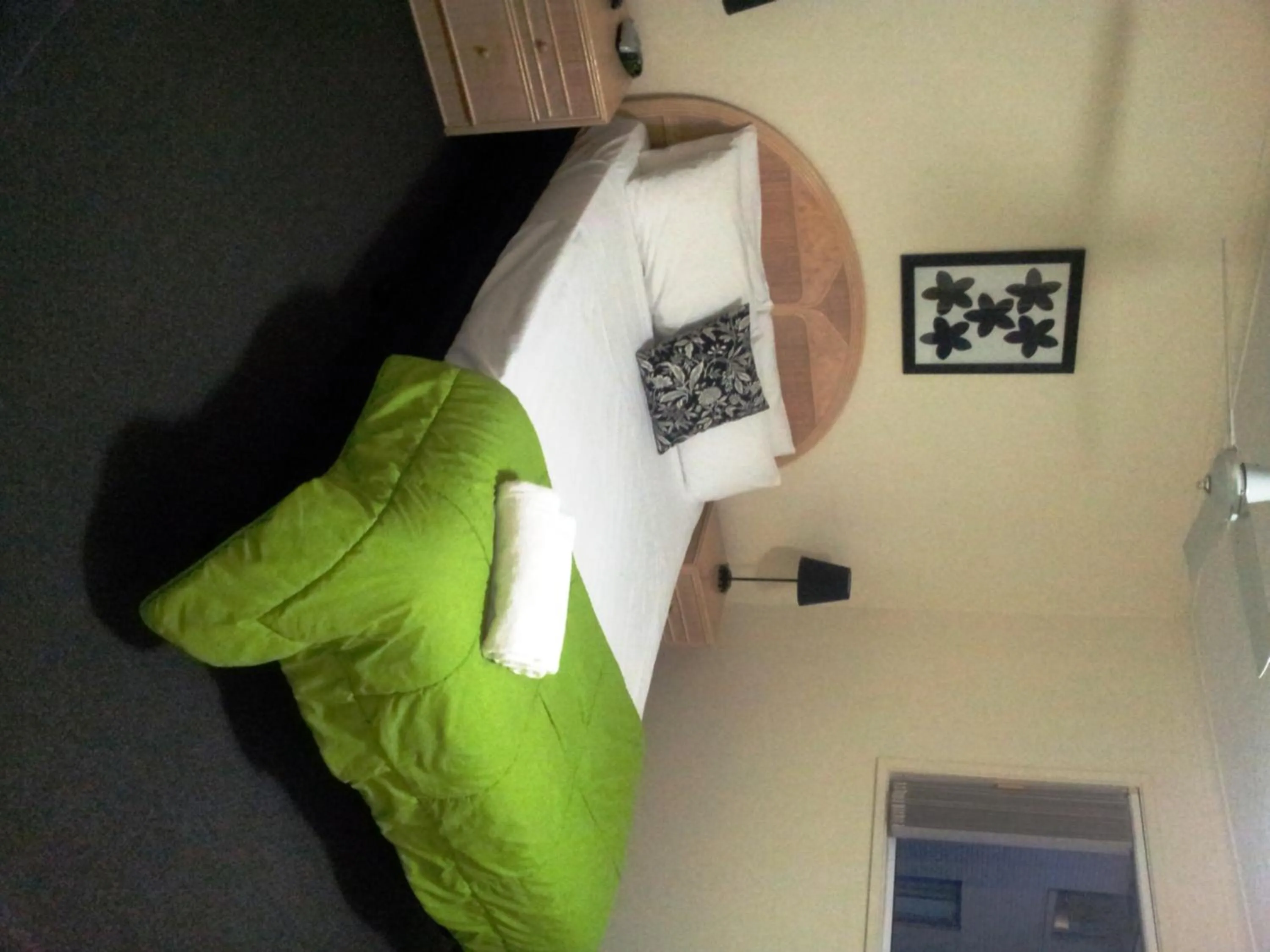 Bed in Champelli Palms Apartments