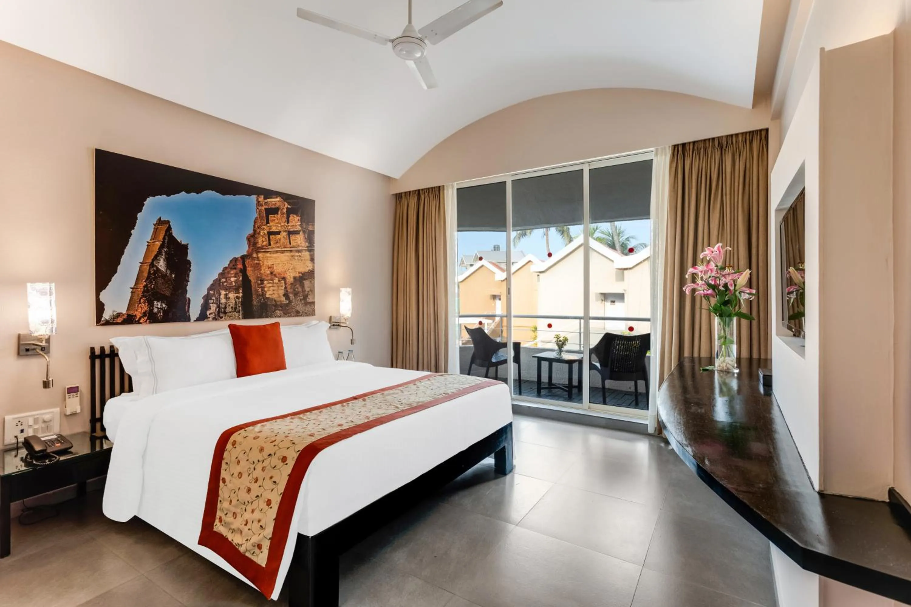 Bed in Whispering Palms Beach Resort