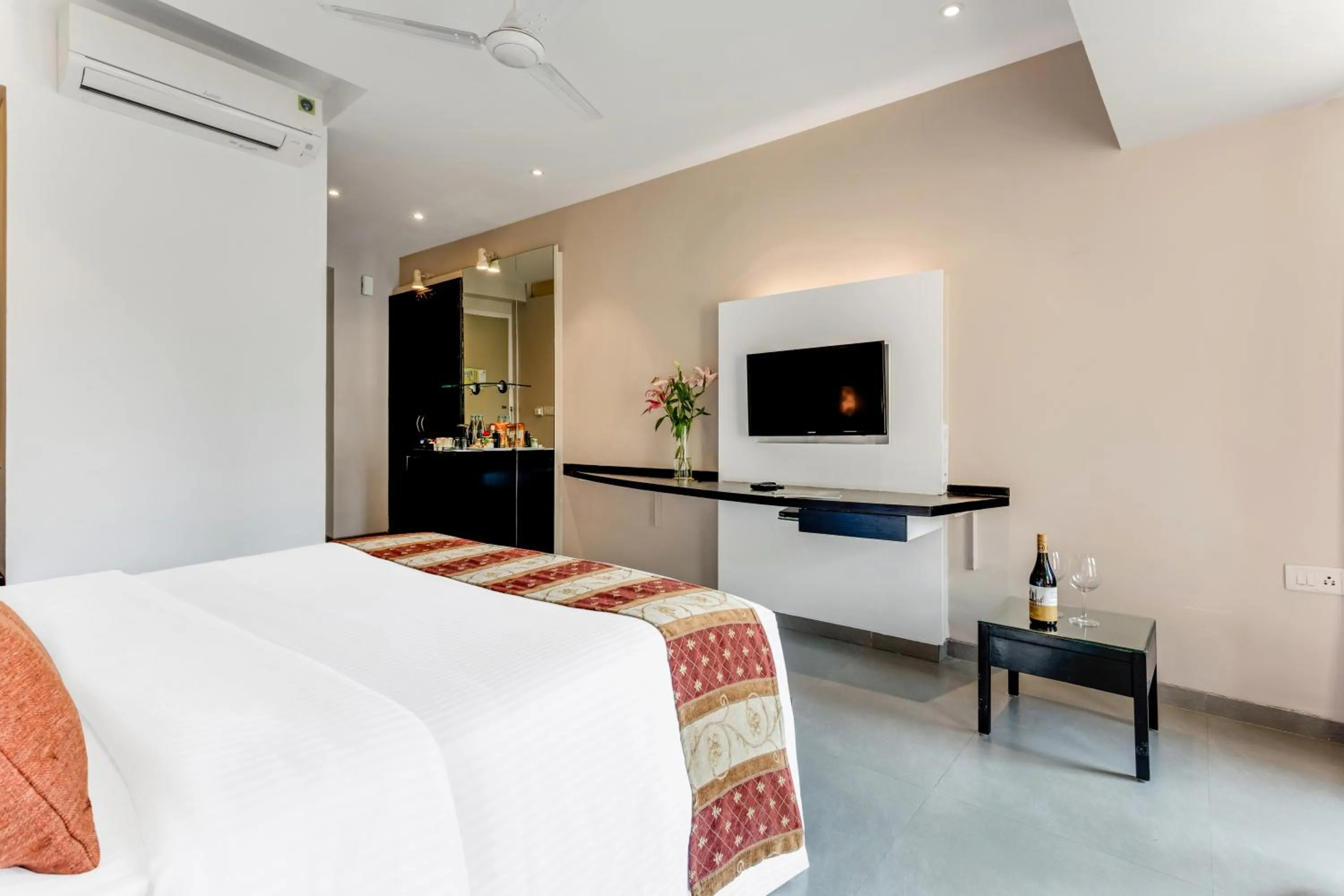 Bed in Whispering Palms Beach Resort