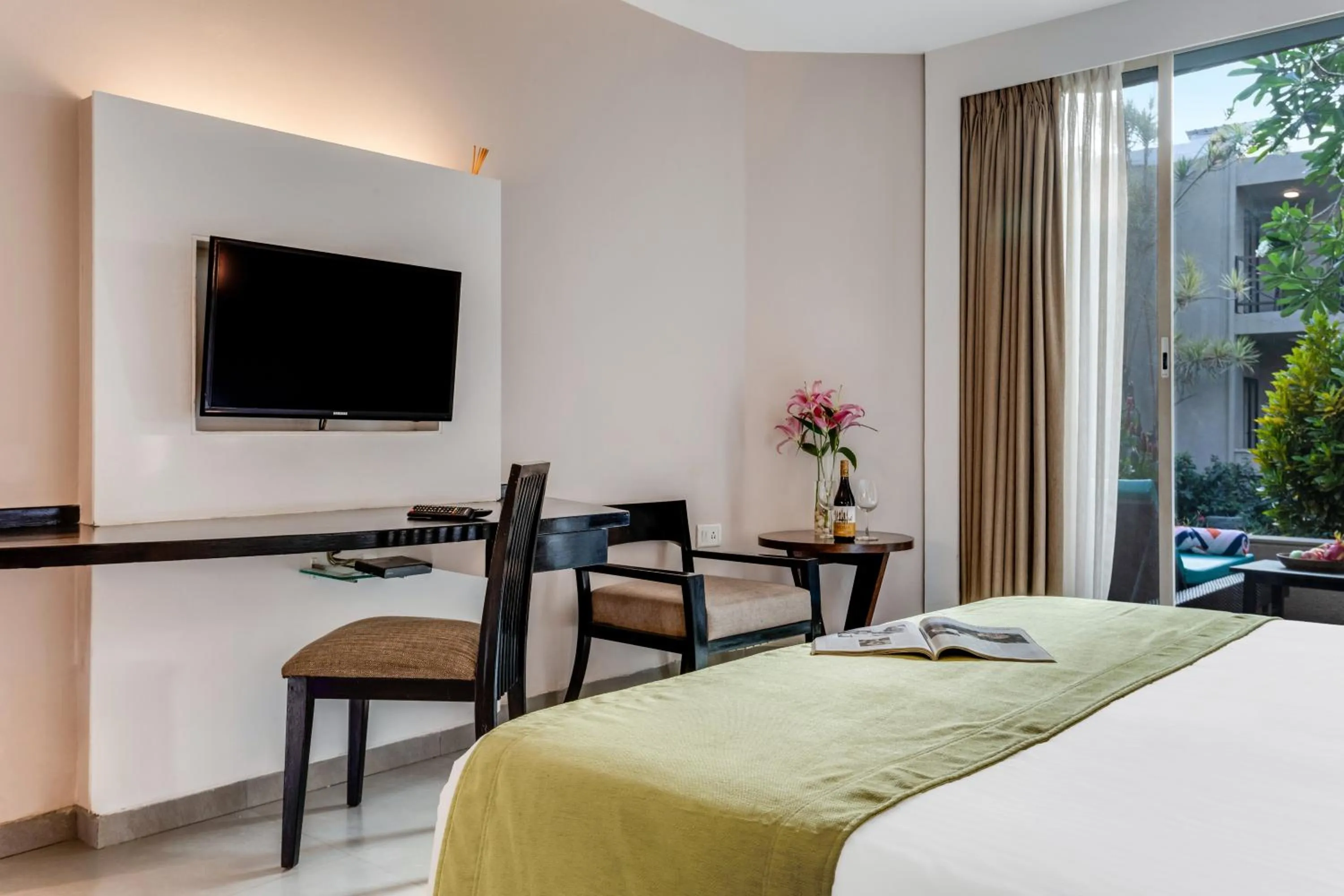 Bed in Whispering Palms Beach Resort