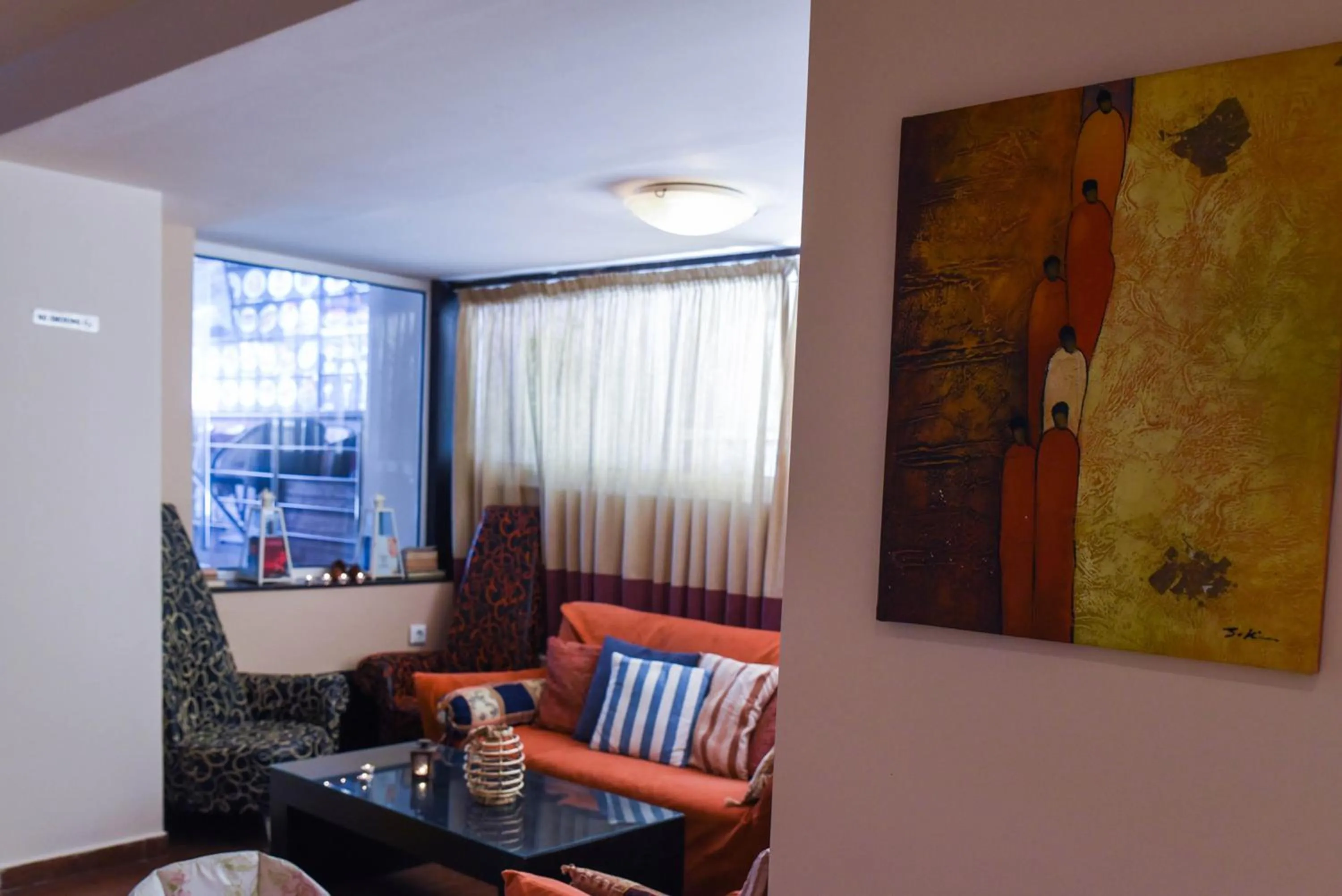 Communal lounge/ TV room, Seating Area in Amaryllis Hotel