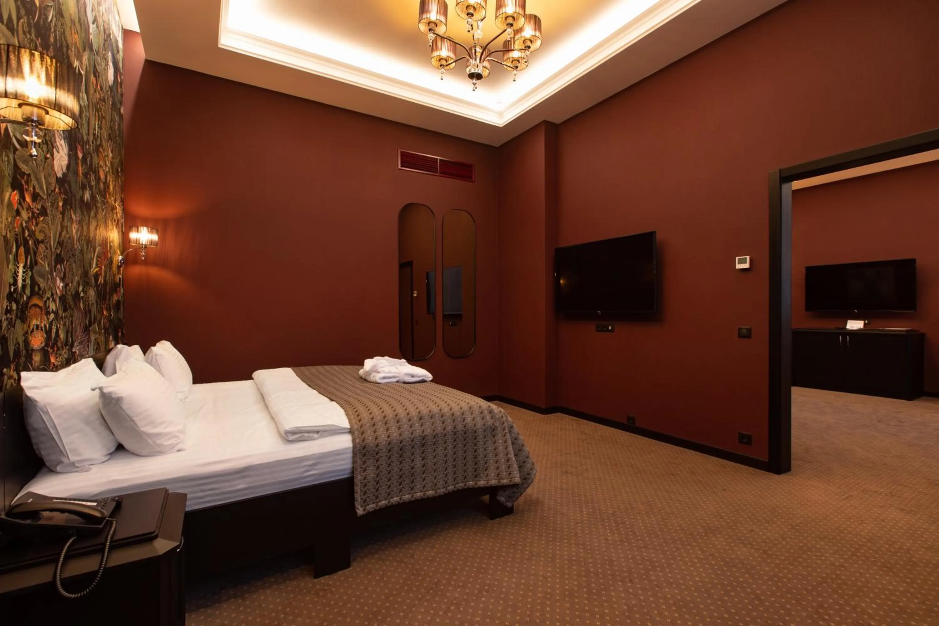 Bed in Tsunami Spa Hotel