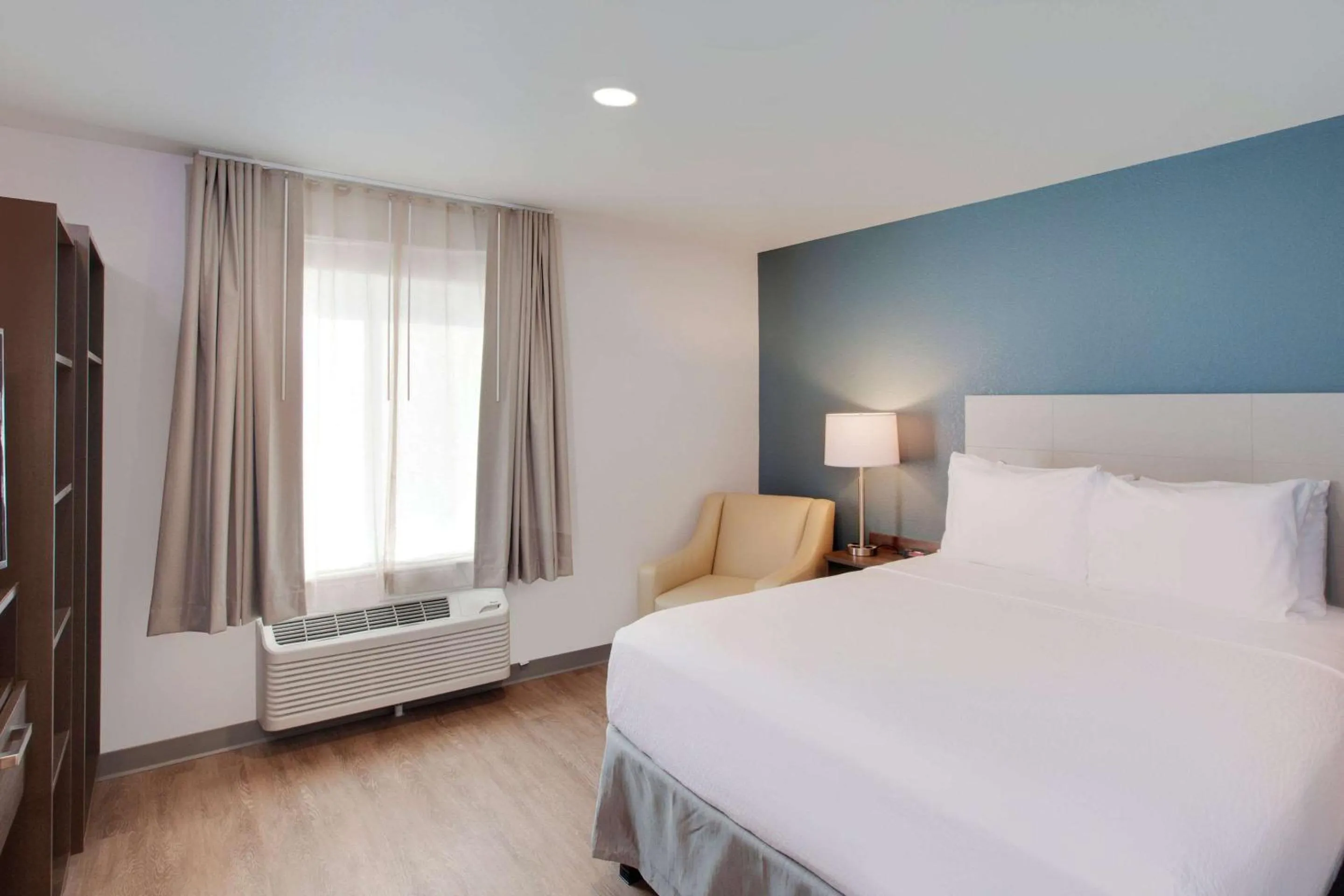 Photo of the whole room, Bed in WoodSpring Suites Houston Northwest