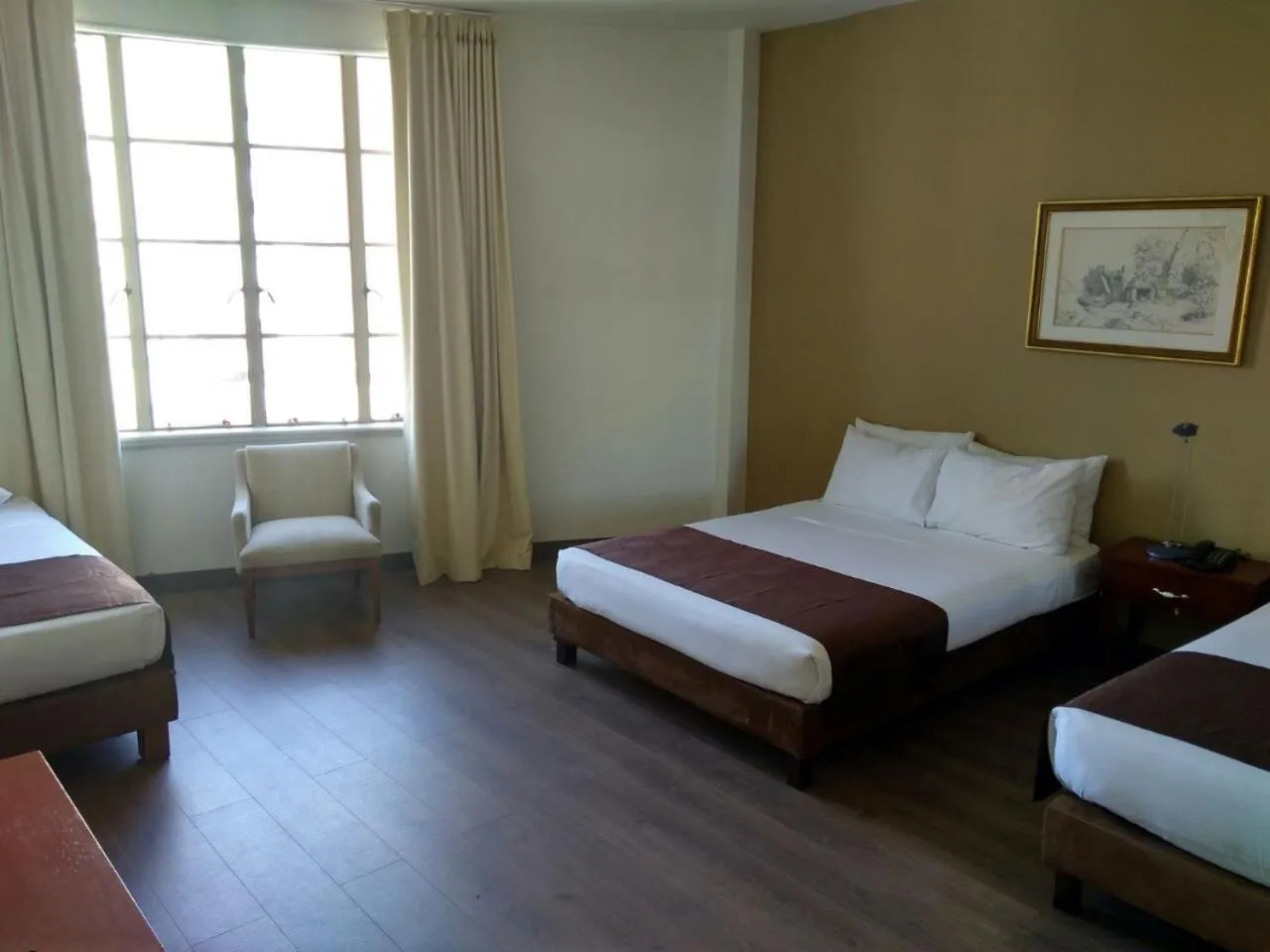 Living room, Bed in Hotel Nutibara