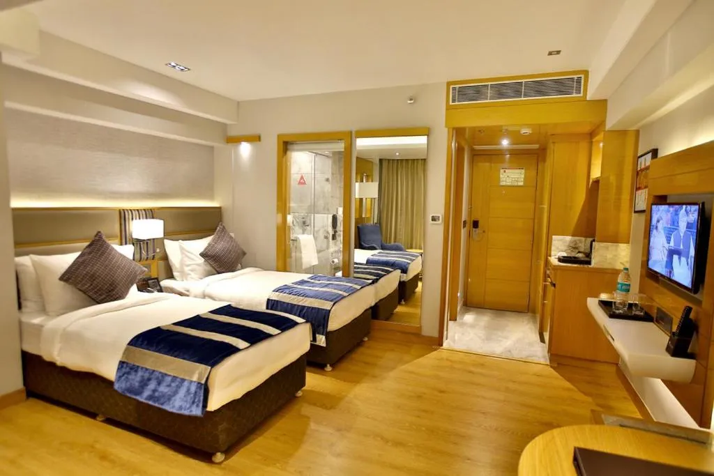 Photo of the whole room, Bed in Regenta Central the Crystal Kanpur,