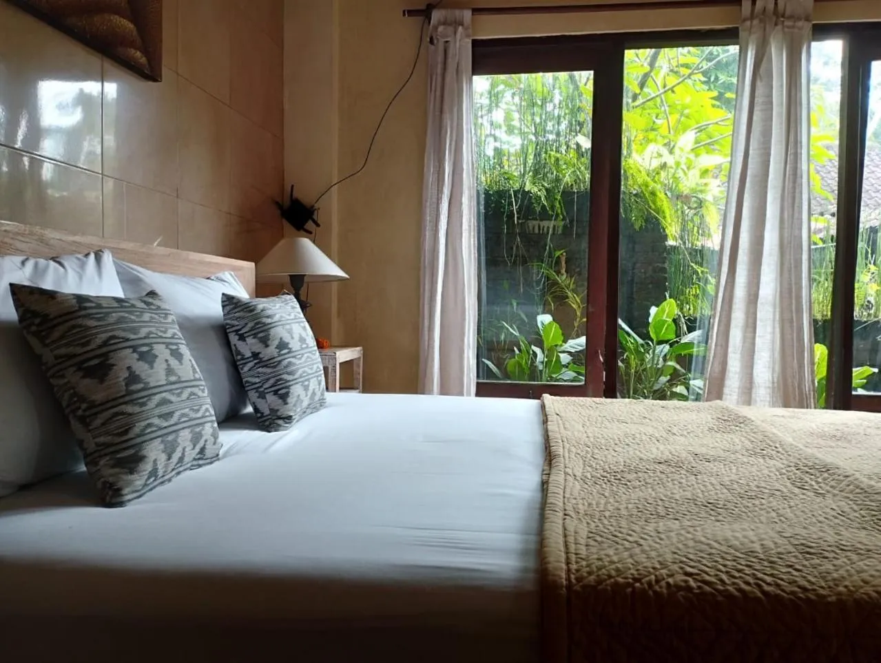 Bed in Umah Ubud Guest House