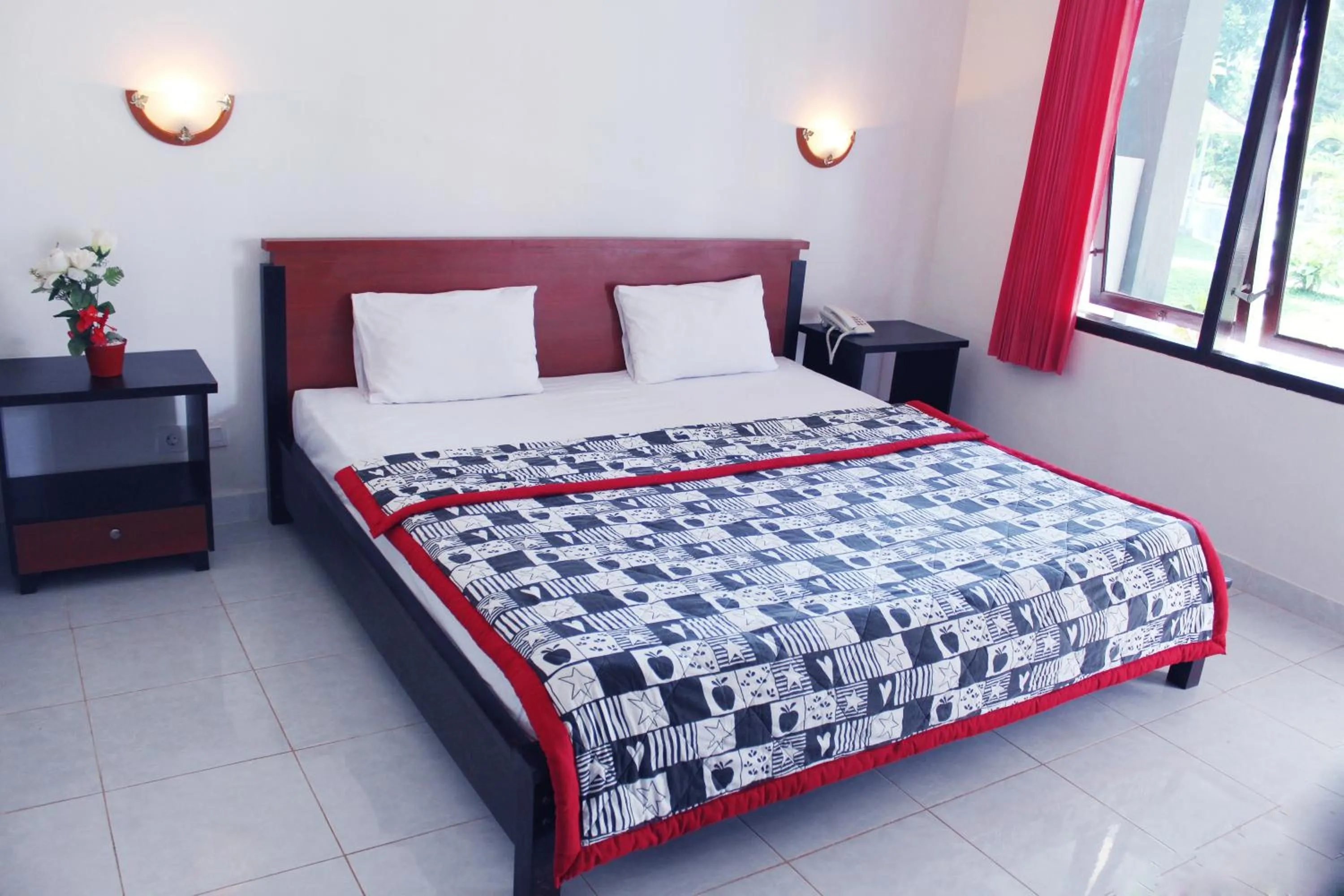 Bed in Aman Gati Hotel Lakey