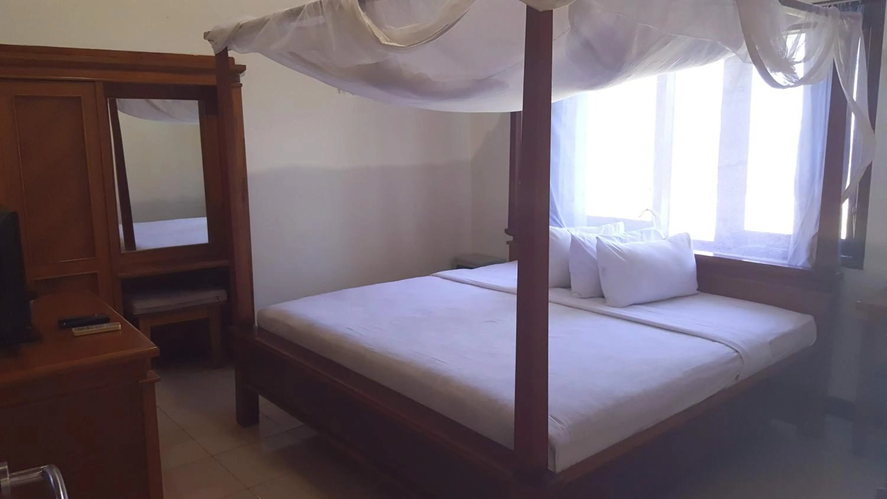 Bed in Aman Gati Hotel Lakey