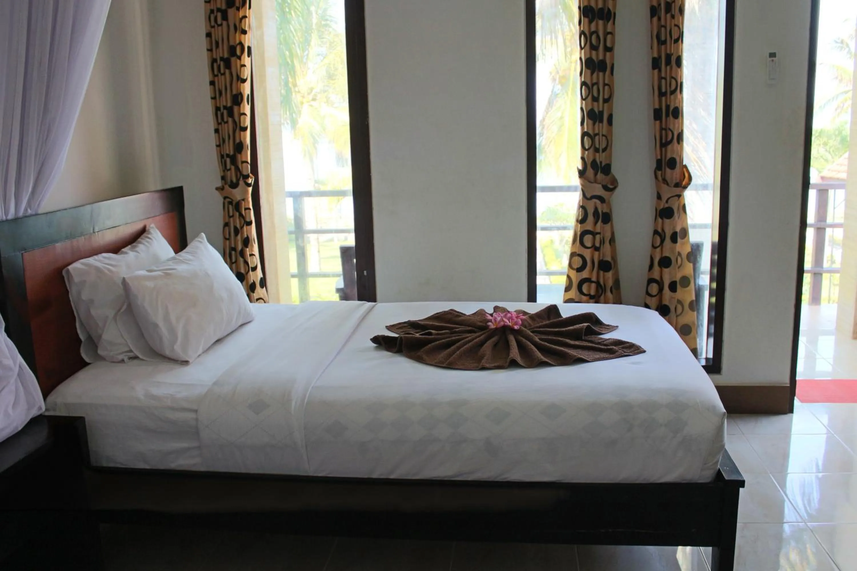 Bed in Aman Gati Hotel Lakey