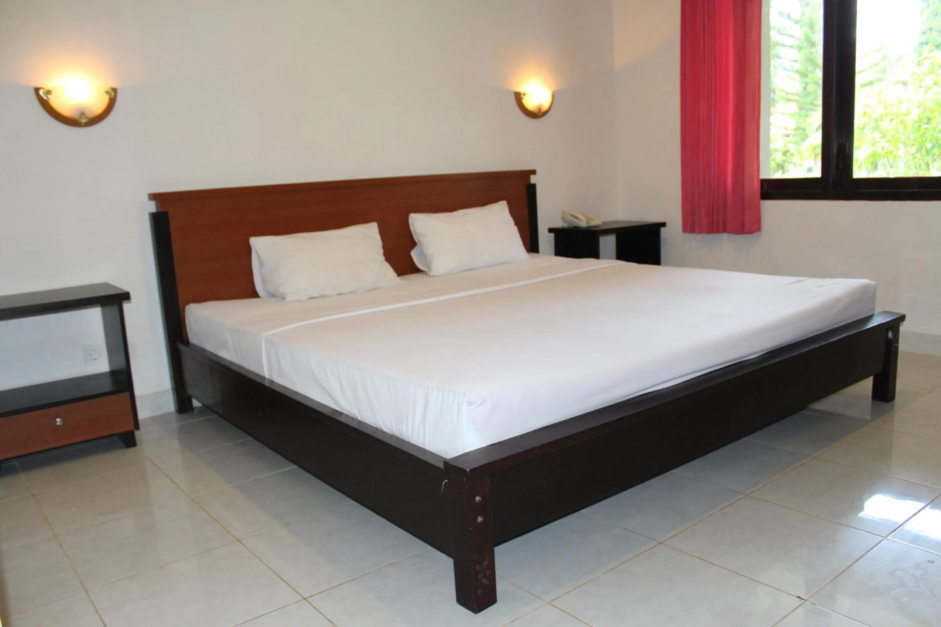 Bed in Aman Gati Hotel Lakey