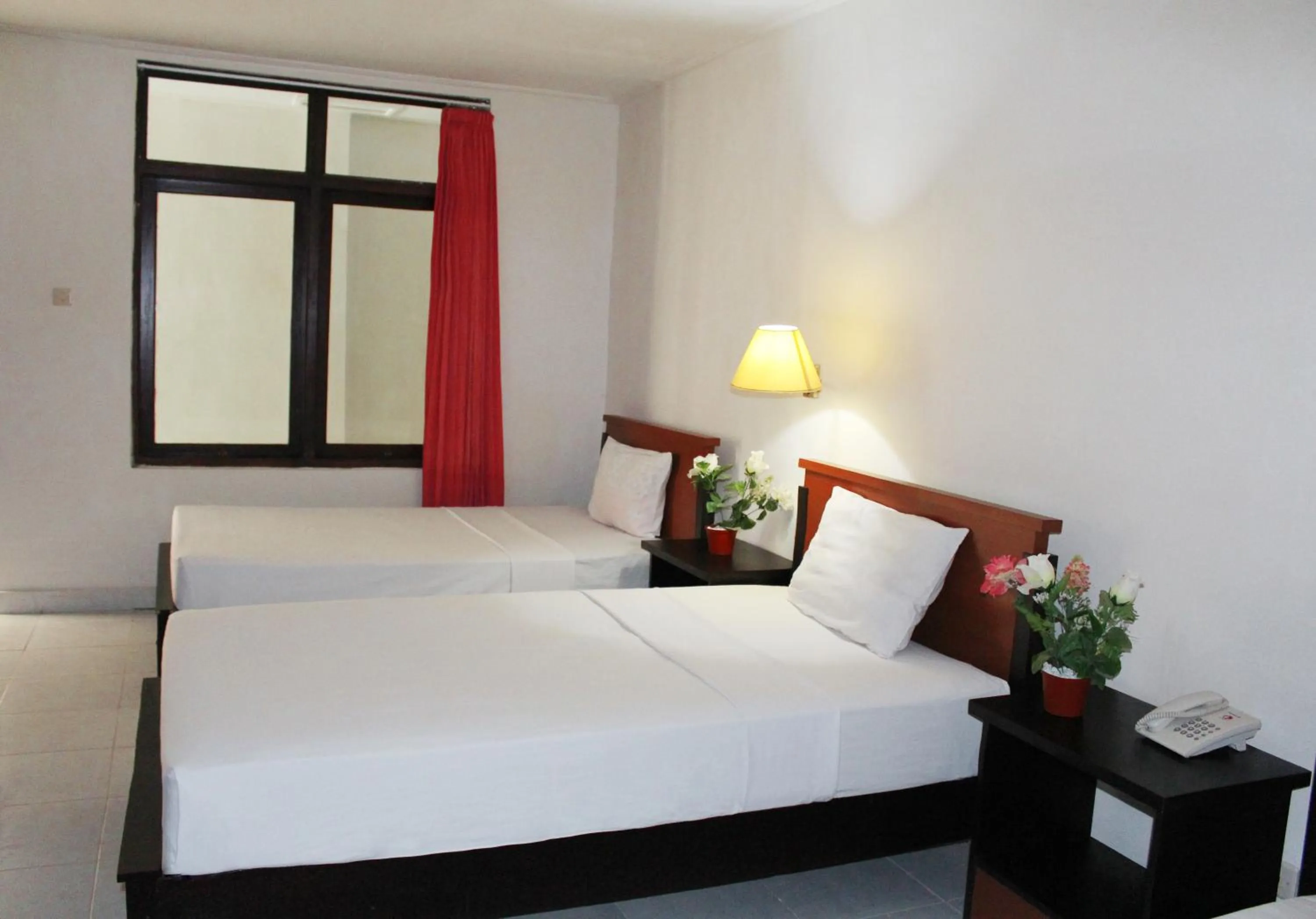 Bed in Aman Gati Hotel Lakey