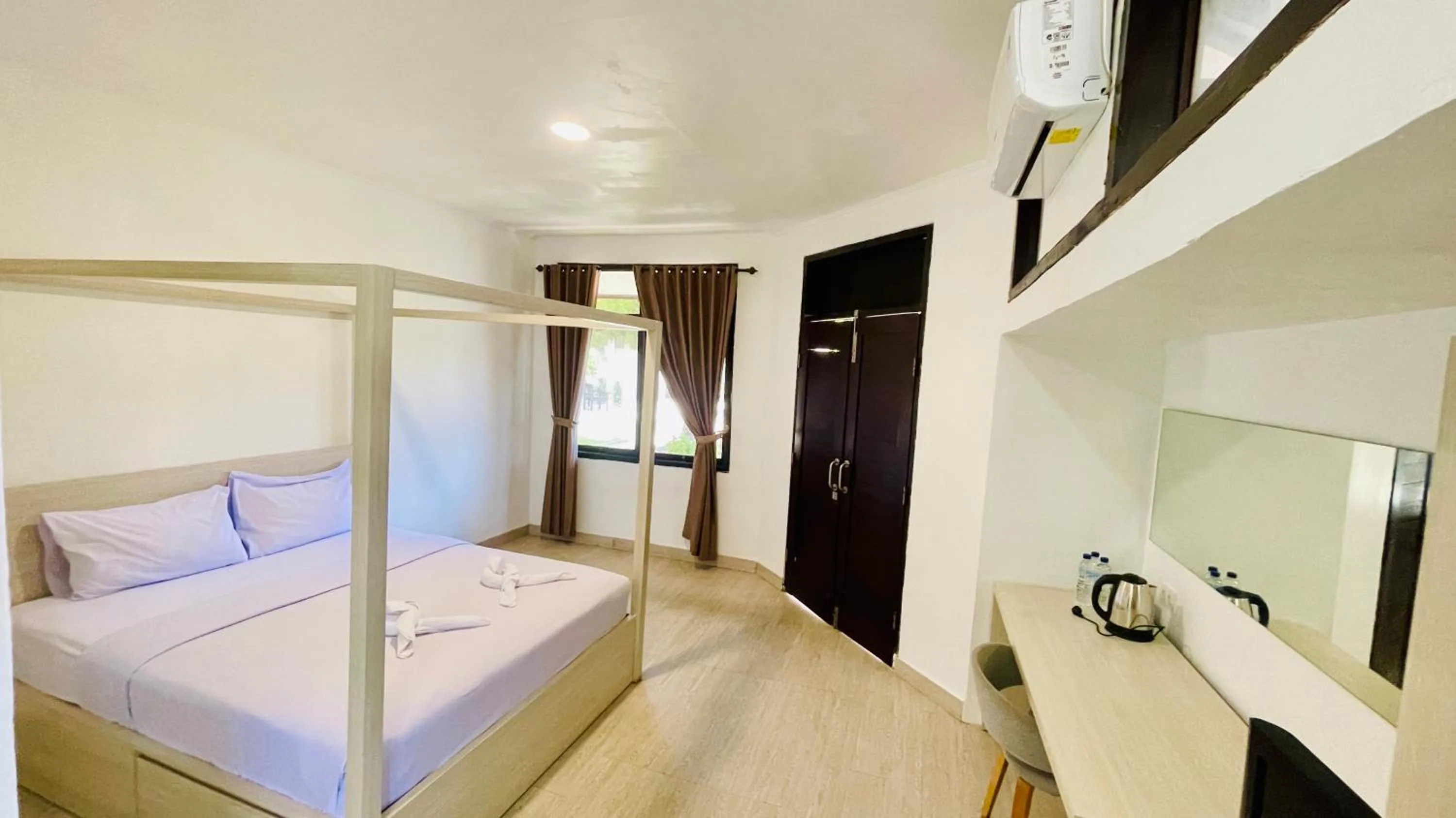 Bed in Aman Gati Hotel Lakey