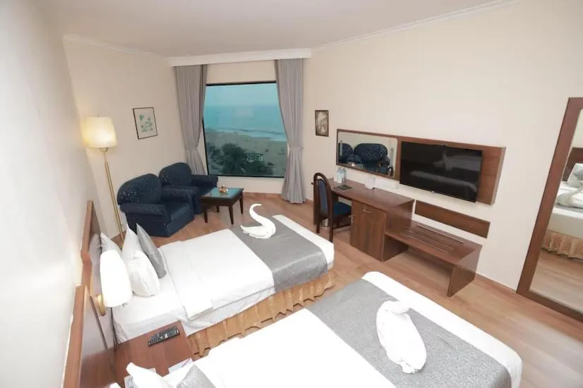 Bed in The Quilon Beach Hotel and Convention Center