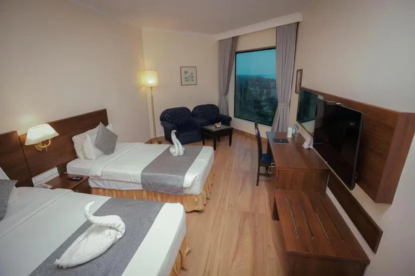 Bed in The Quilon Beach Hotel and Convention Center