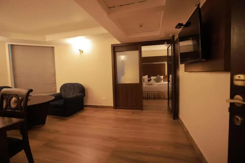 Living room, Bed in The Quilon Beach Hotel and Convention Center