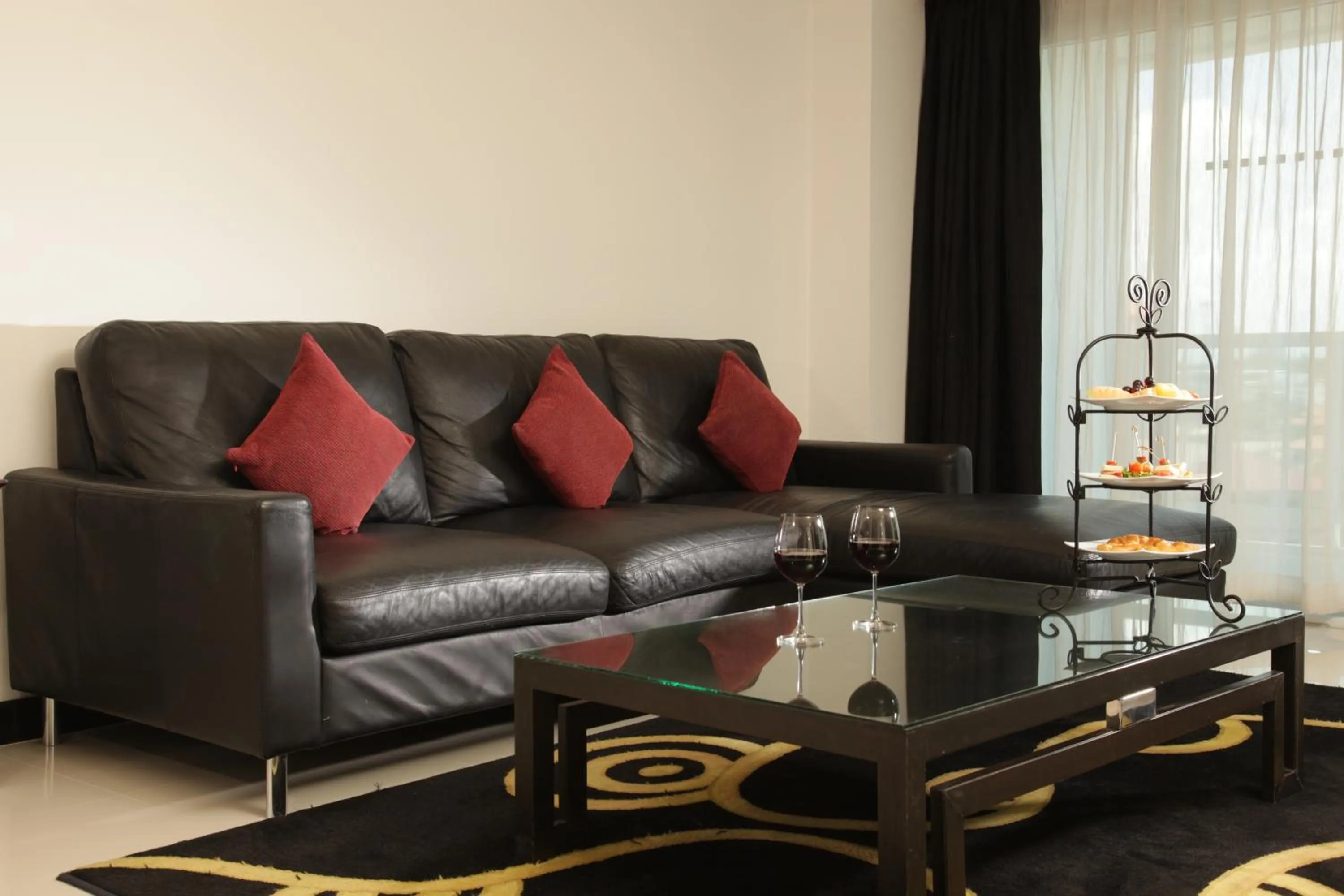 Living room in Nova Suites Pattaya by Compass Hospitality