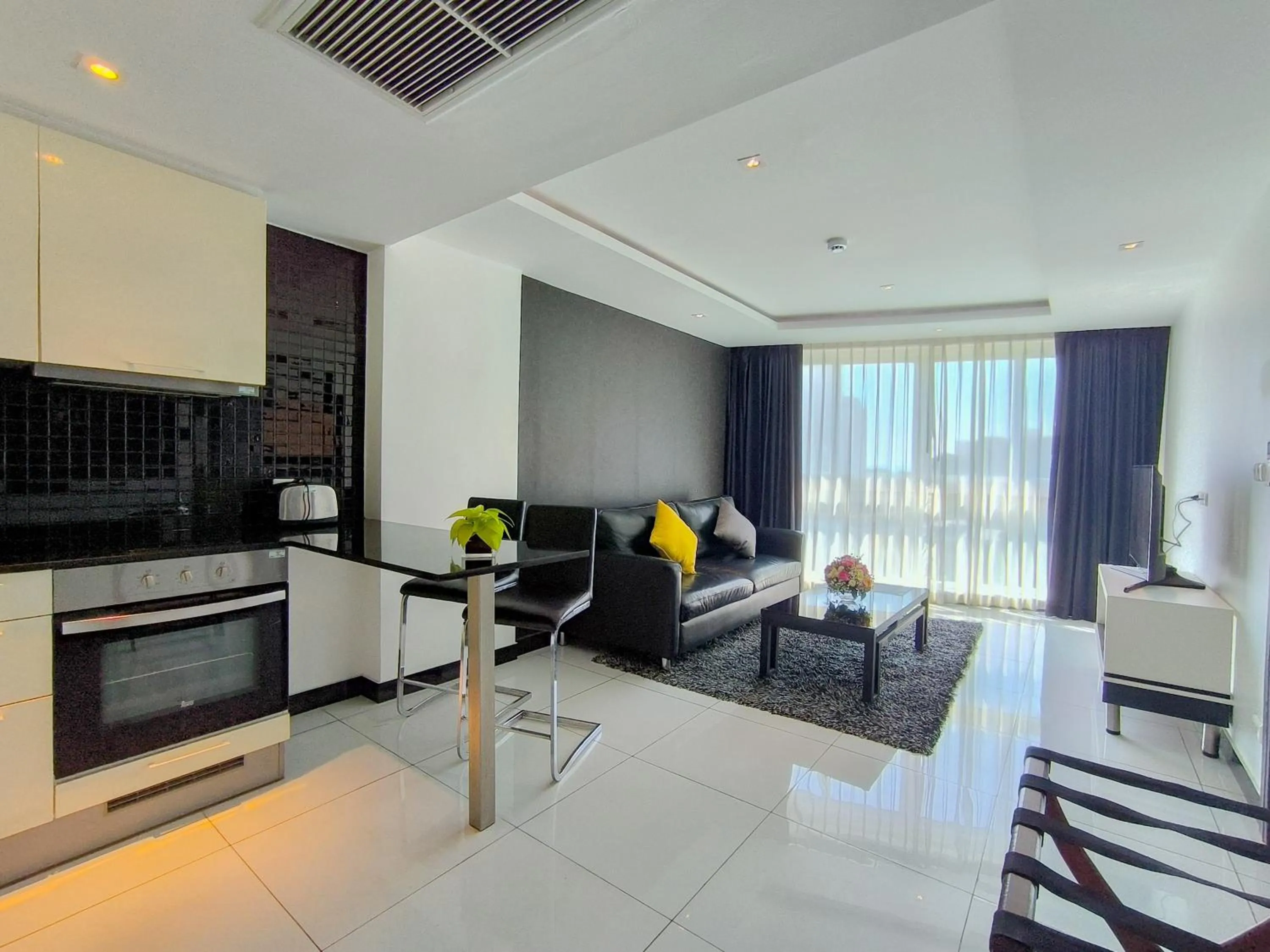 Kitchen or kitchenette in Nova Suites Pattaya by Compass Hospitality