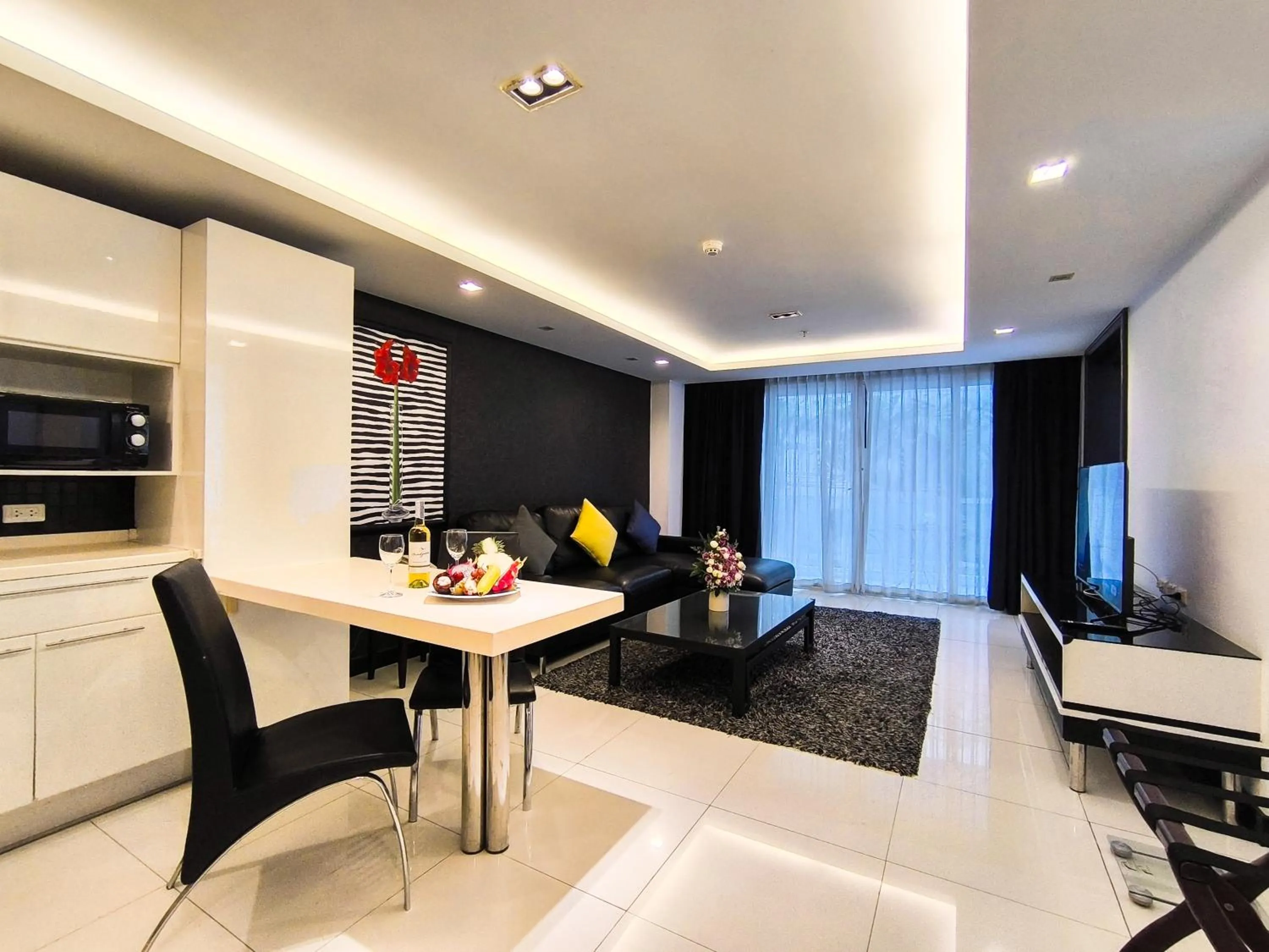 Living room in Nova Suites Pattaya by Compass Hospitality