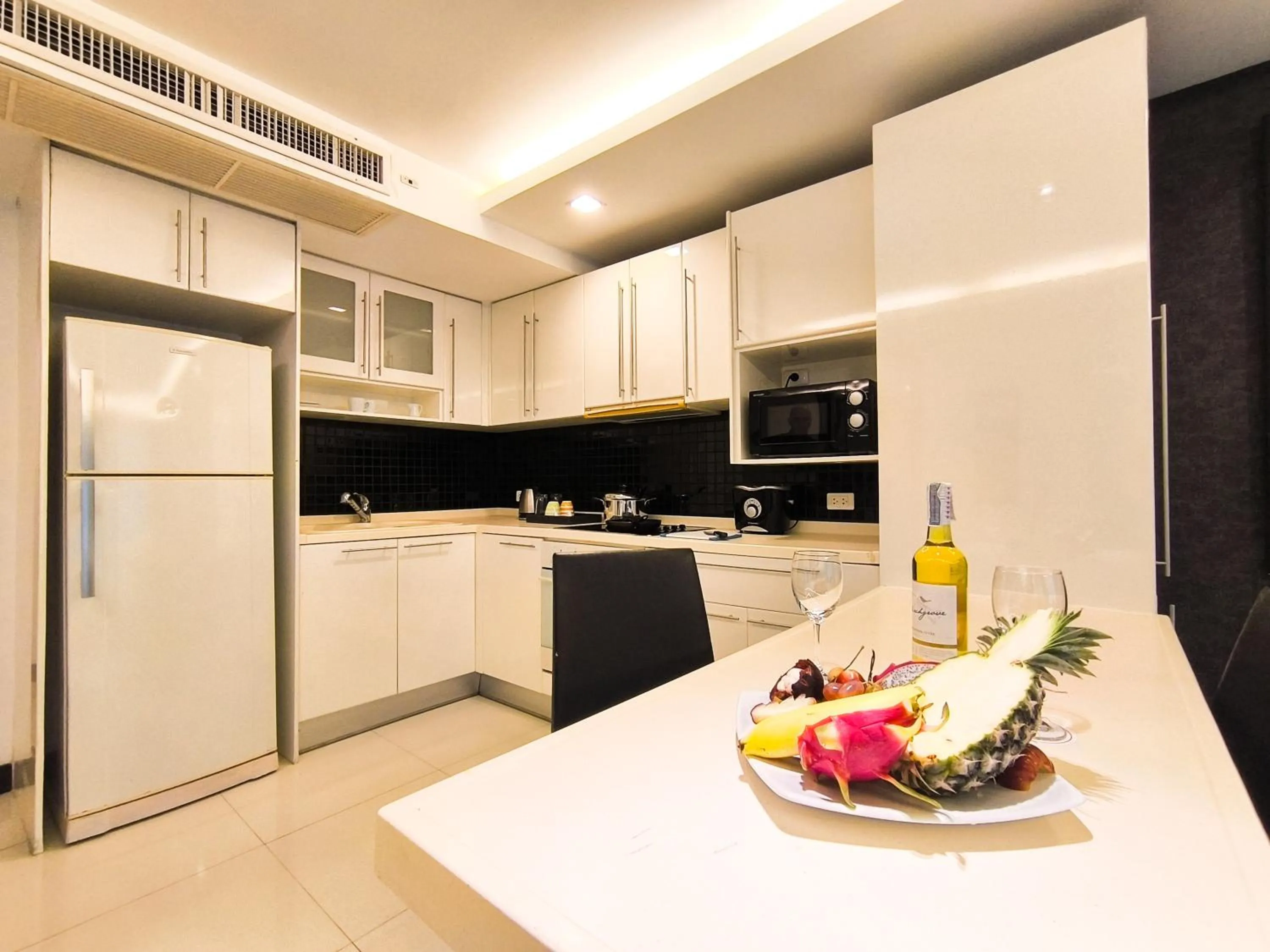 Kitchen or kitchenette in Nova Suites Pattaya by Compass Hospitality