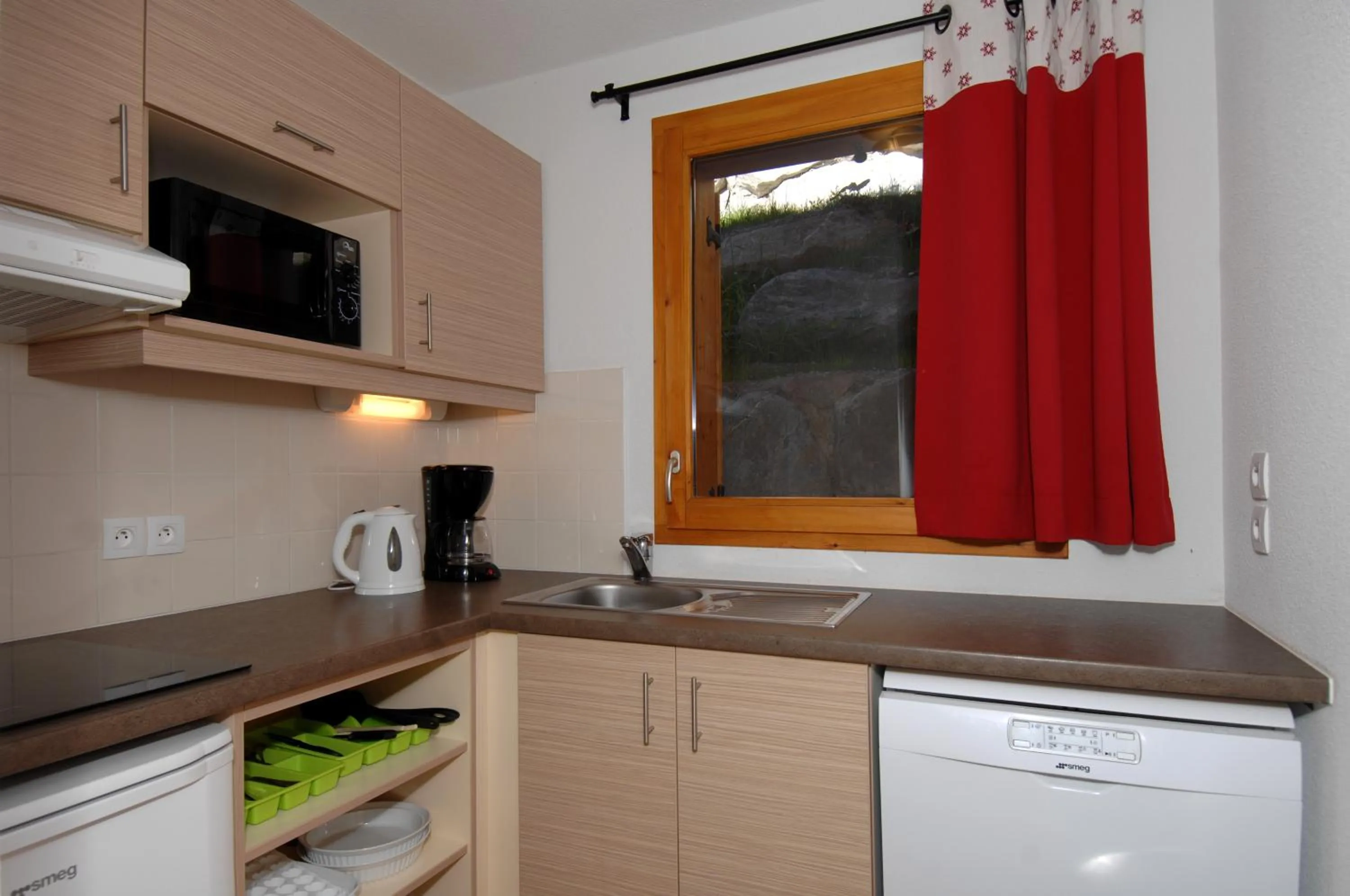 Kitchen or kitchenette in Résidence Odalys Le Grand Panorama 1