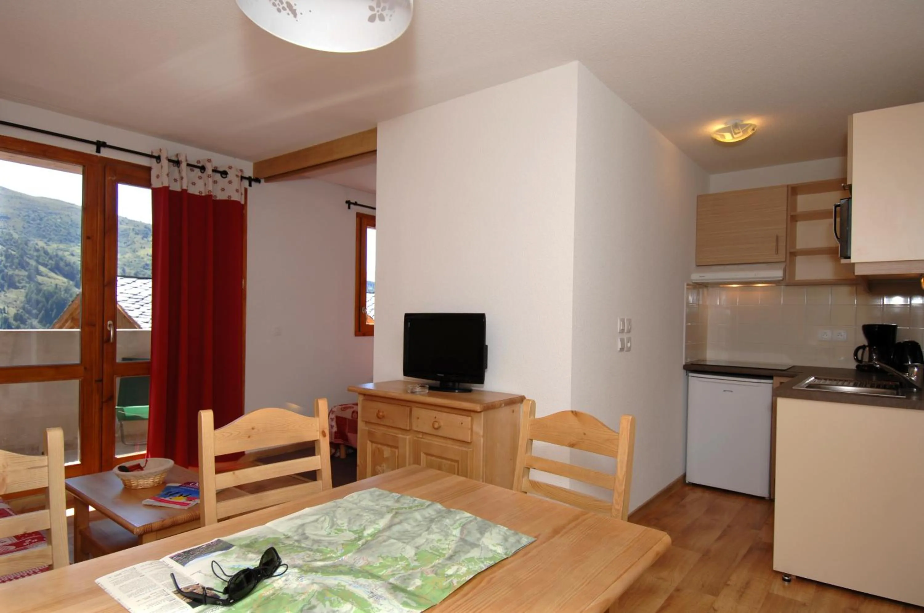 Kitchen or kitchenette in Résidence Odalys Le Grand Panorama 1