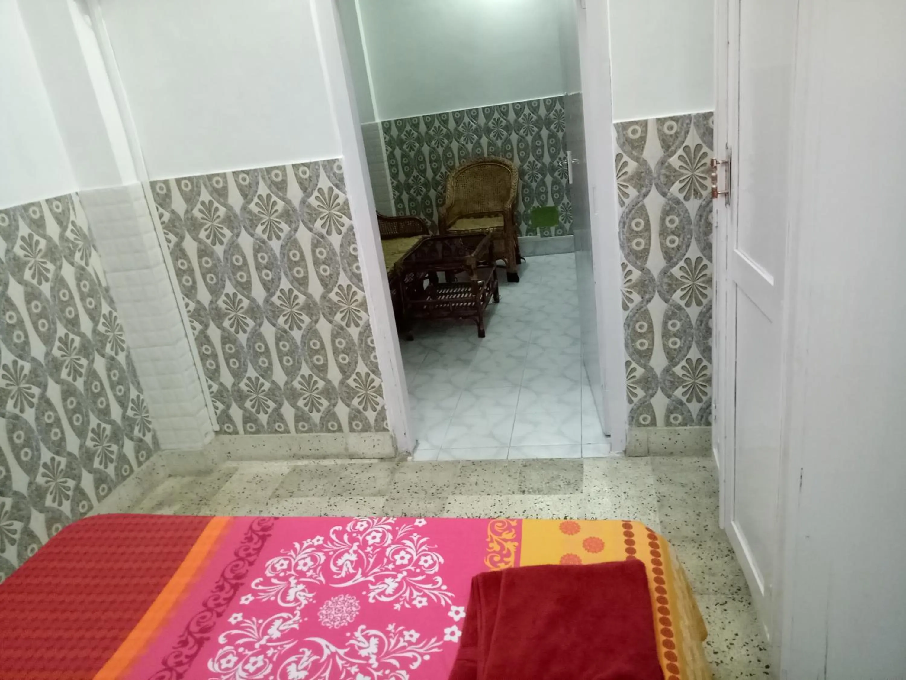 Seating area, Bed in Hotel Kameng