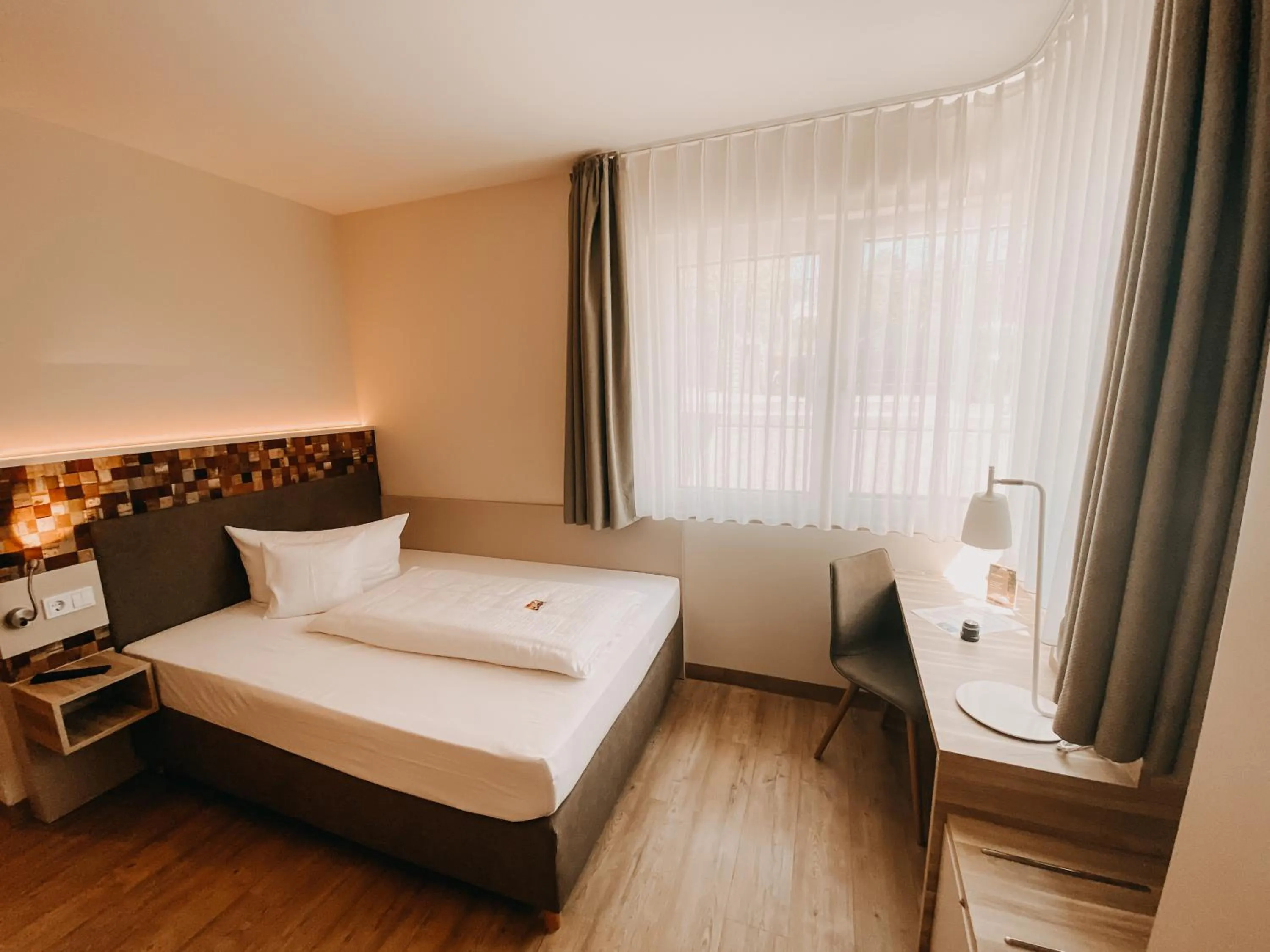 Bed in Weinhotel Wasem