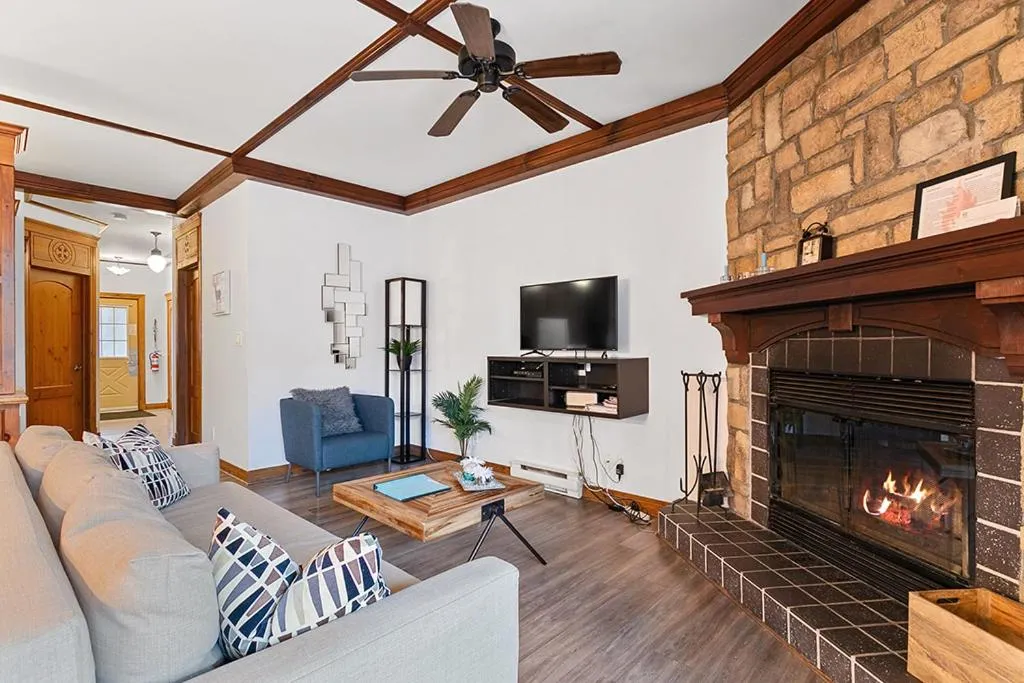 Living room in Le Manoir 106-7 by Escapades Tremblant