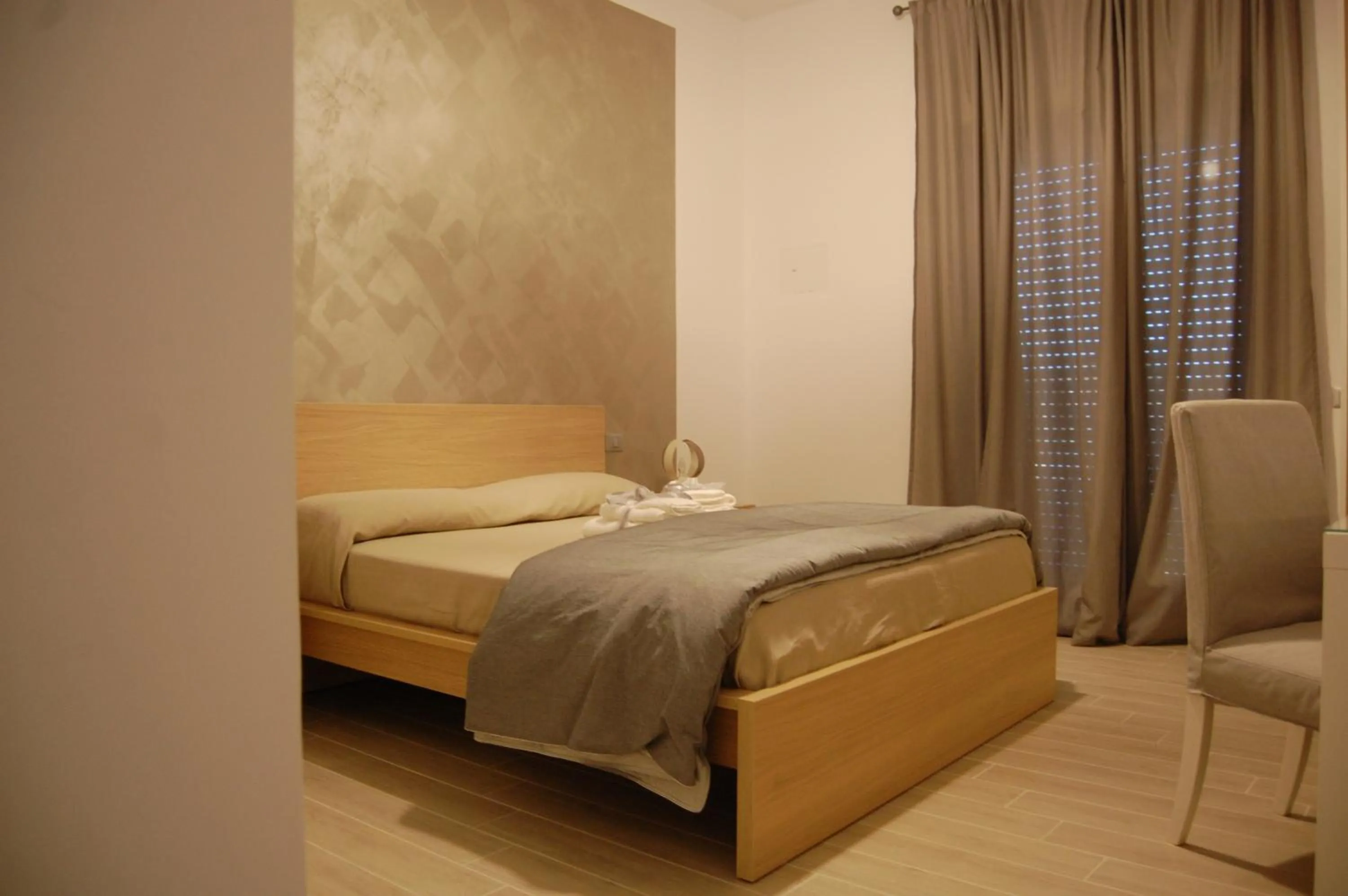 Communal lounge/ TV room, Bed in B&B da Francesco