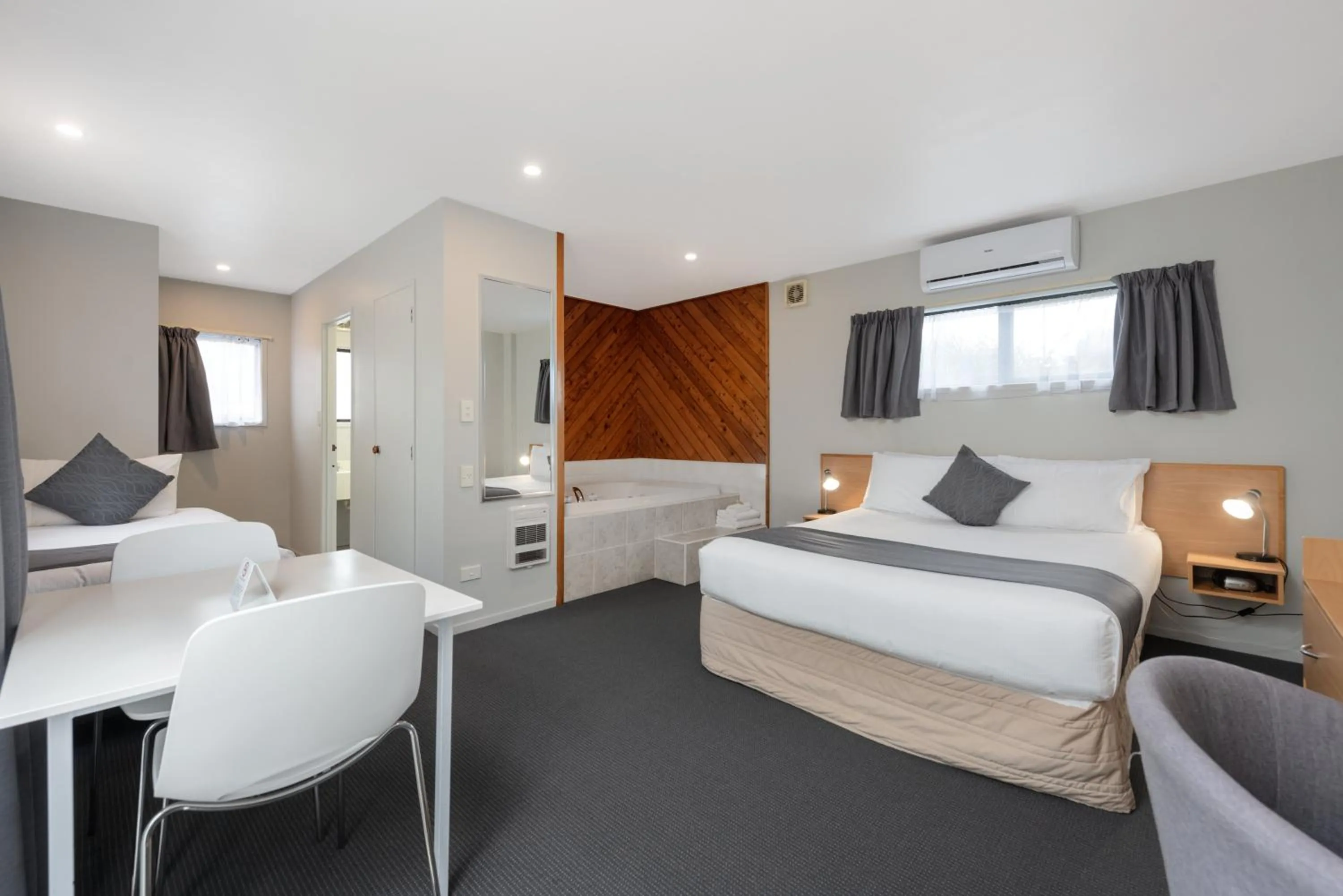 Seating area, Bed in ASURE Macy's Motor Inn