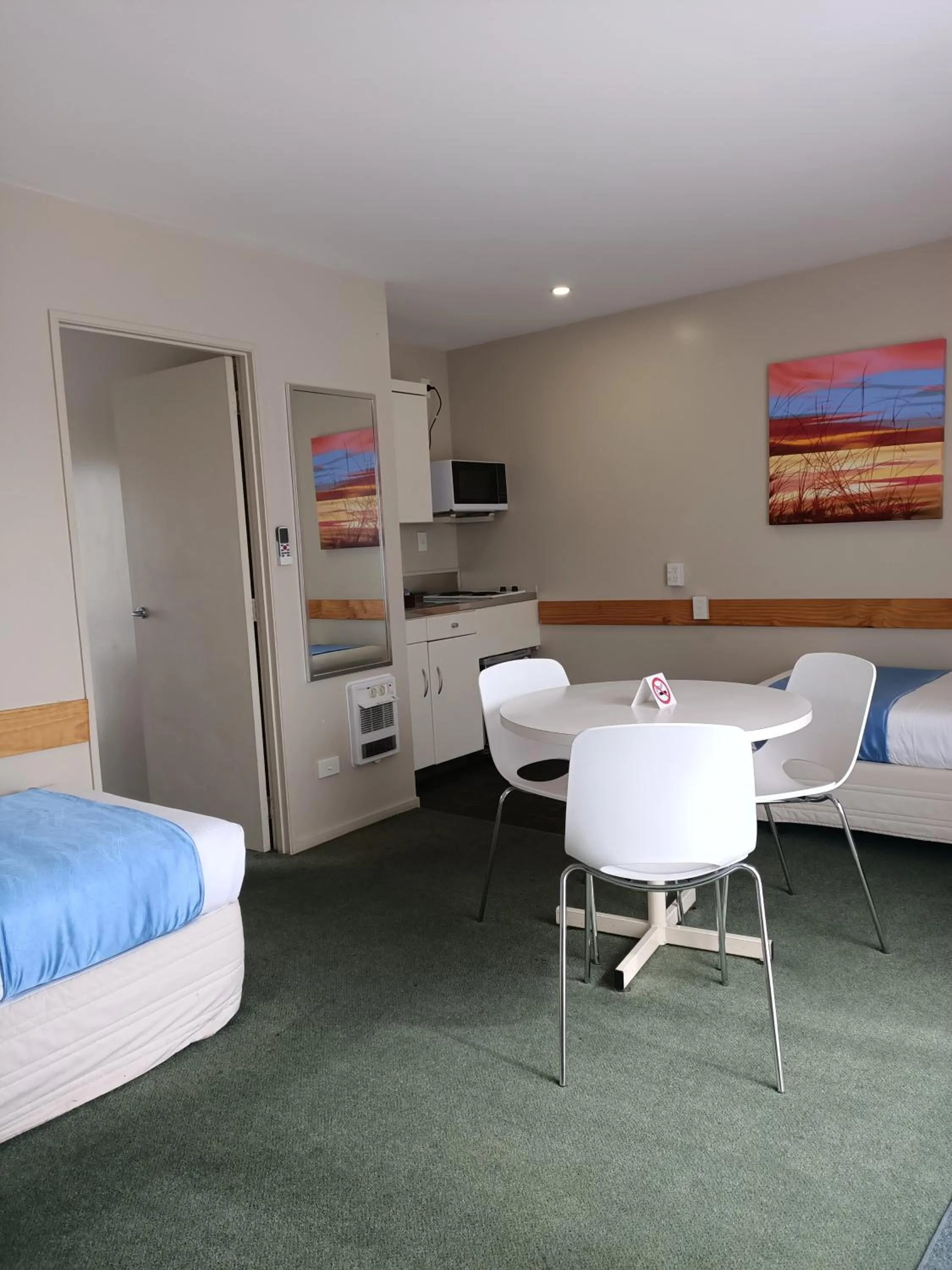 Living room in ASURE Macy's Motor Inn