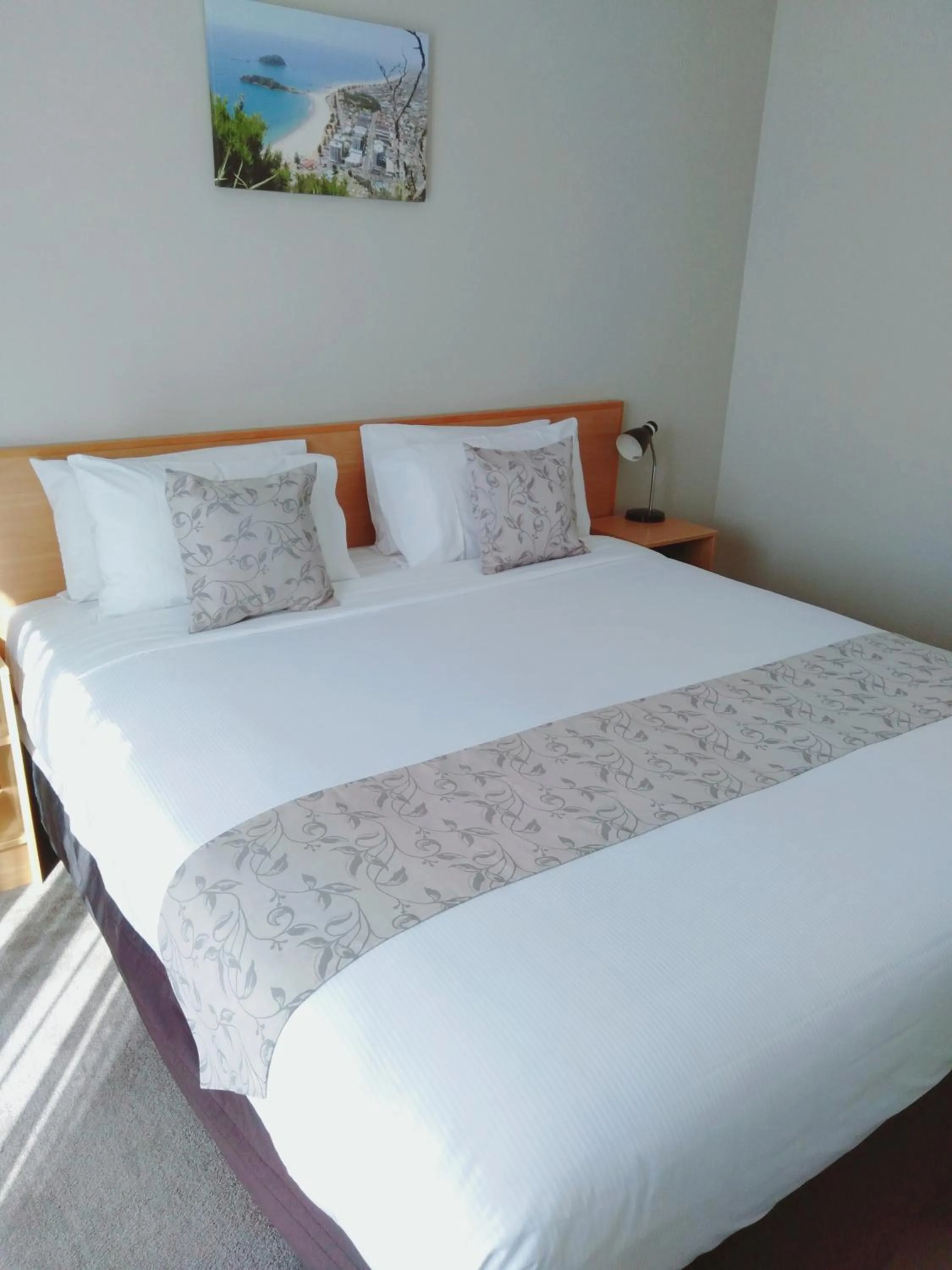 Bed in ASURE Macy's Motor Inn