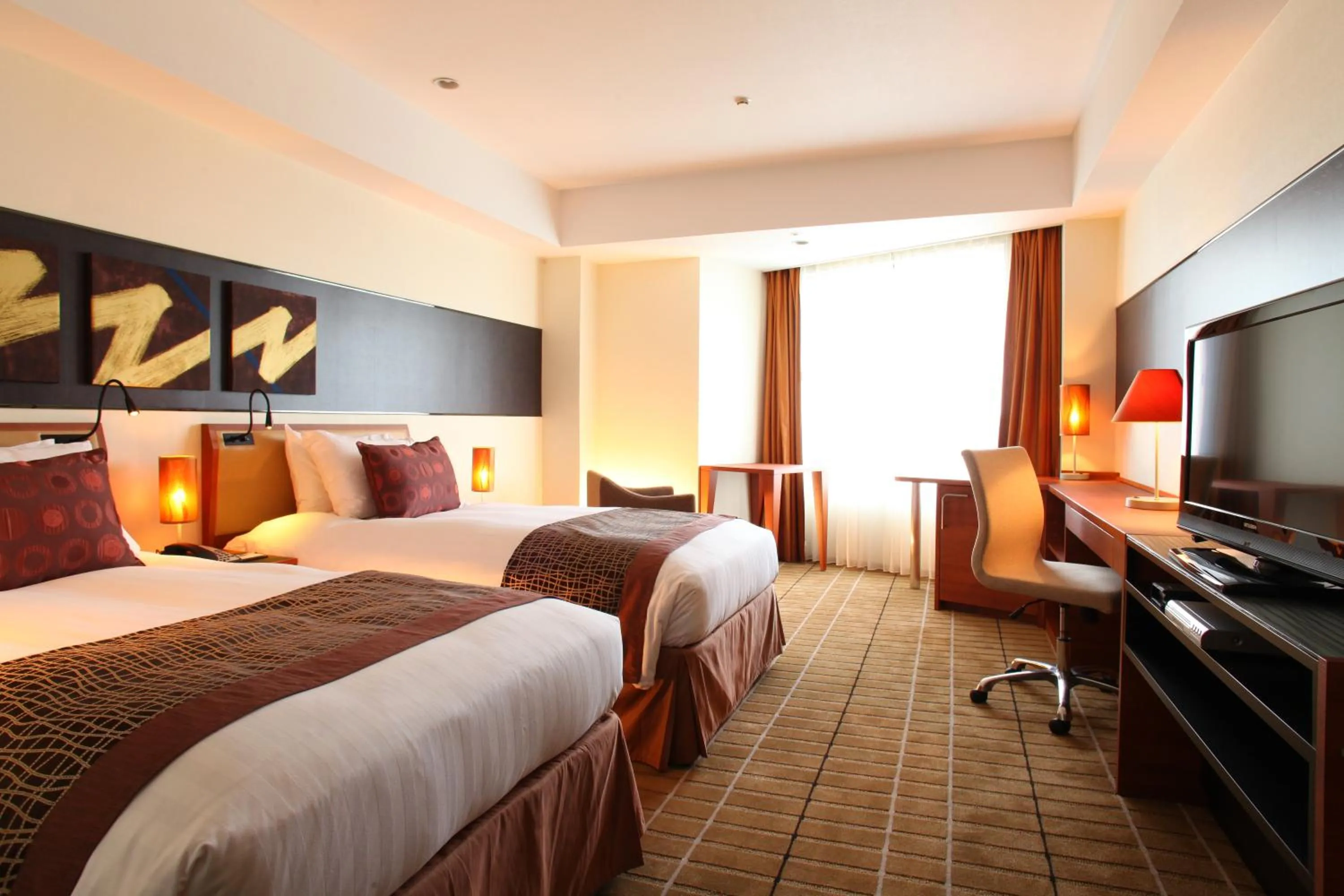 Bed in International Resort Hotel Yurakujo