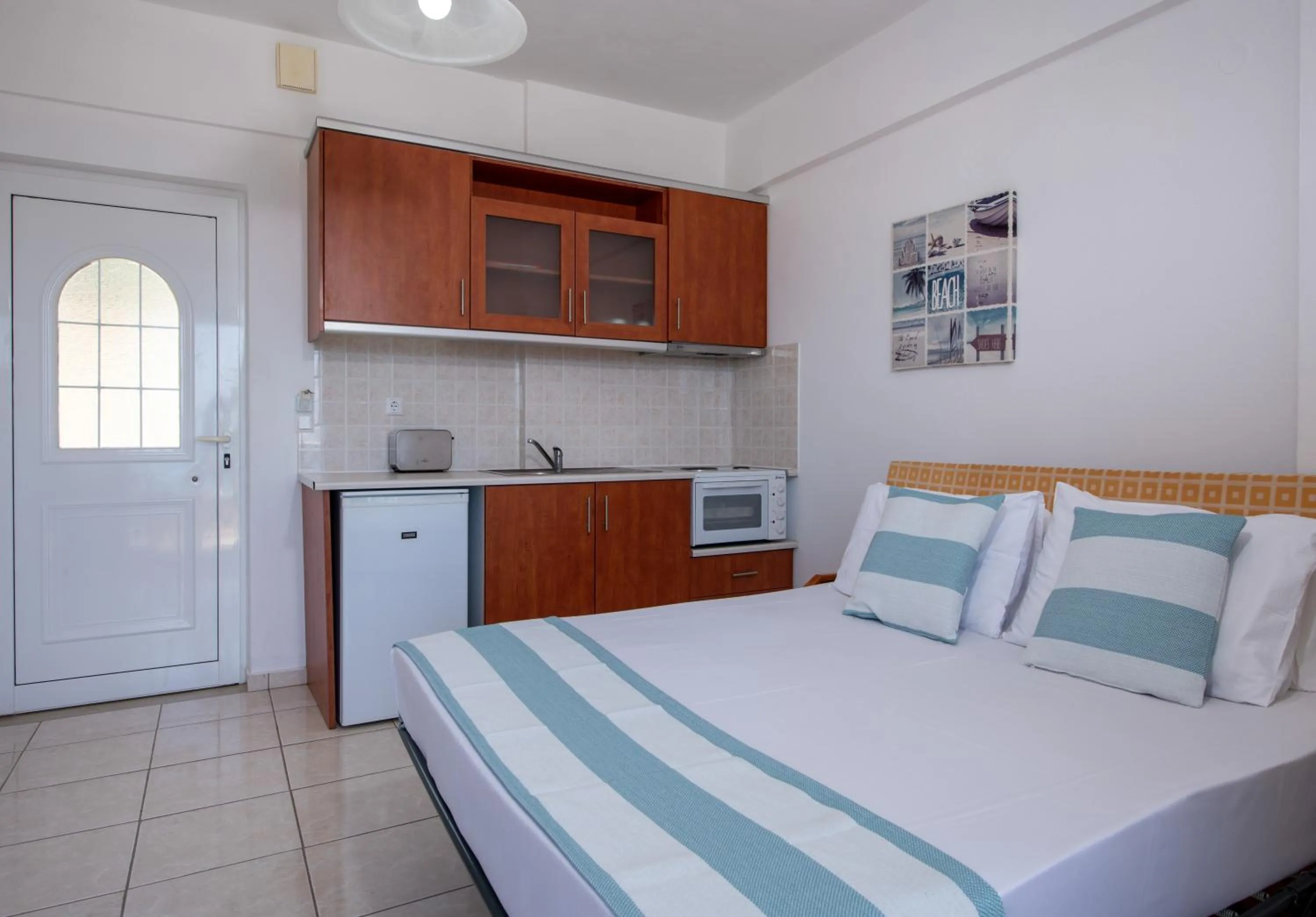 Bed in Sunrise Apartments