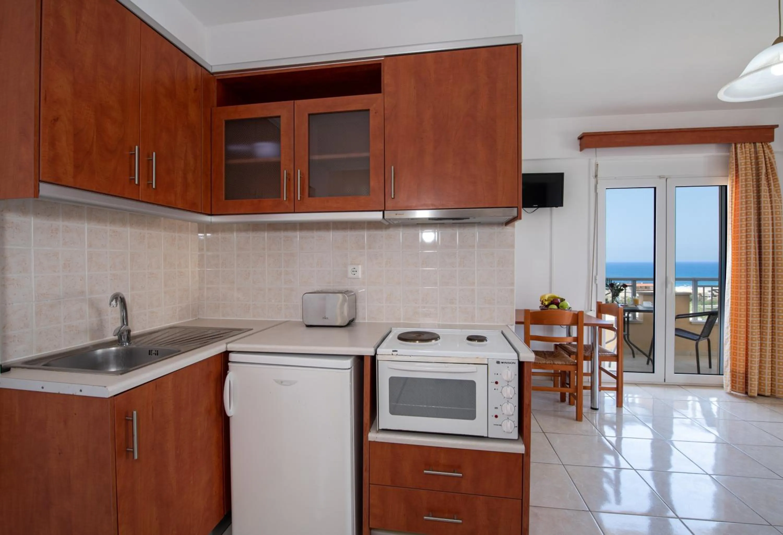 Kitchen or kitchenette in Sunrise Apartments