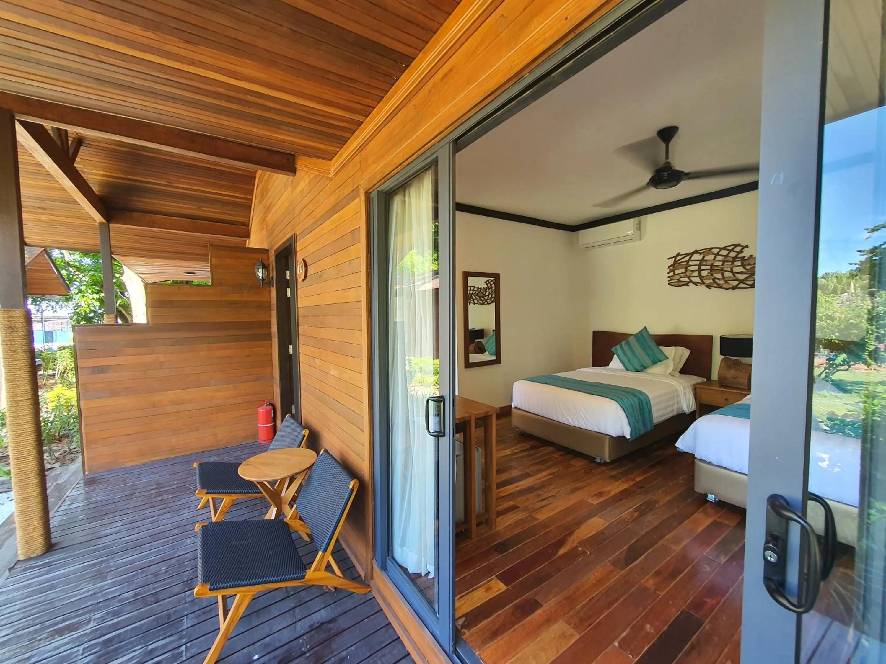 Bed in Borneo Divers Mabul Resort