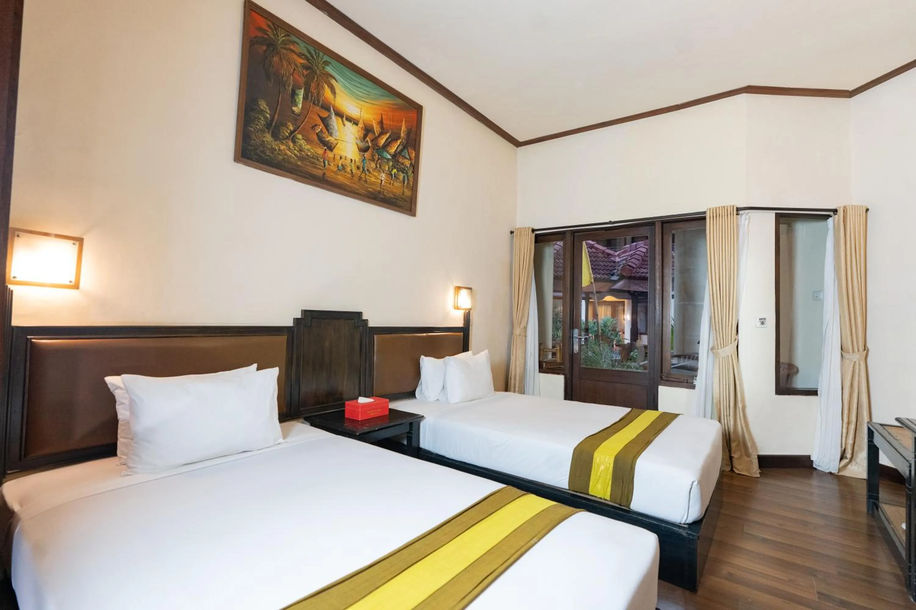 Bed in The Flora Kuta Bali