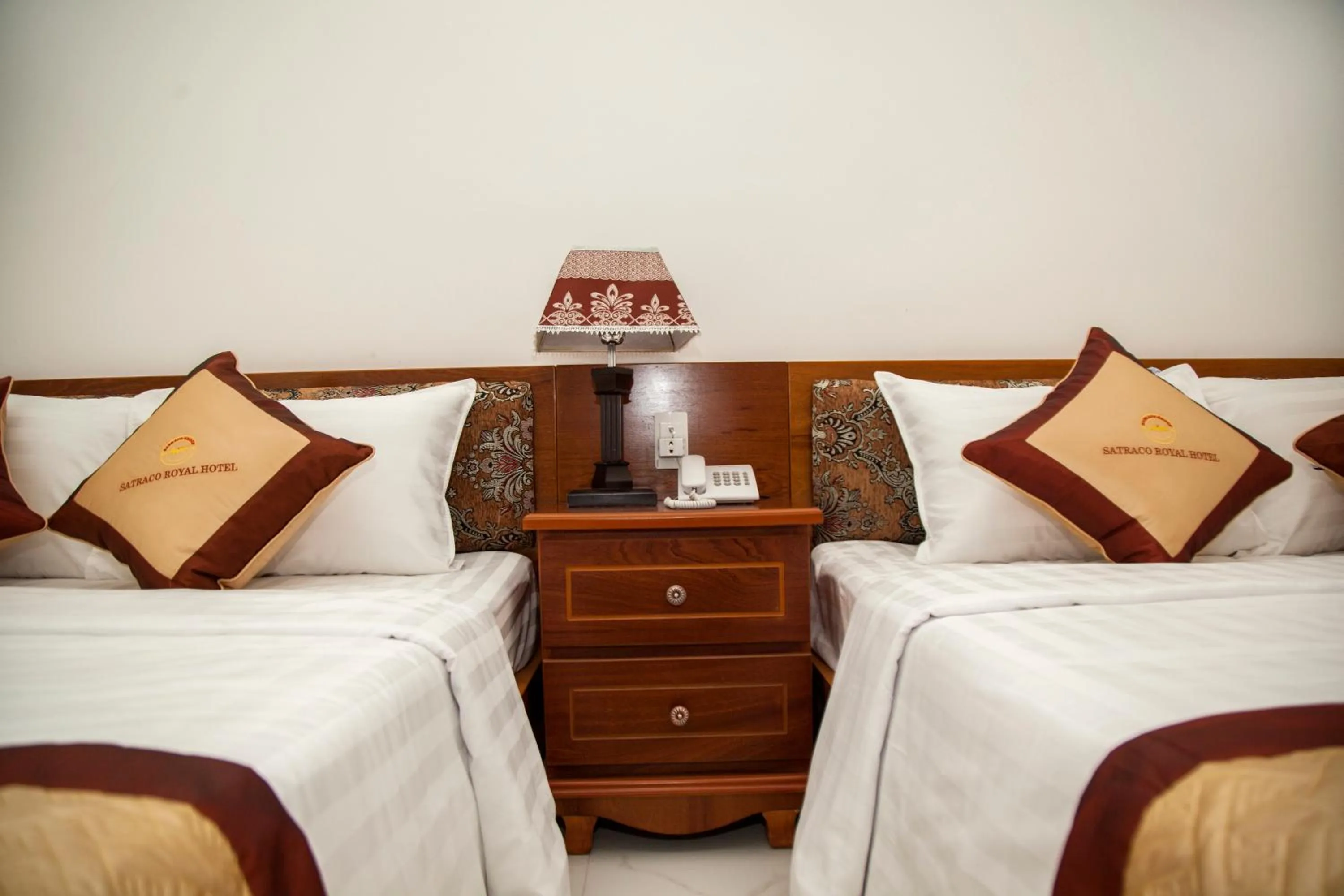 Bed in Satraco Royal Hotel