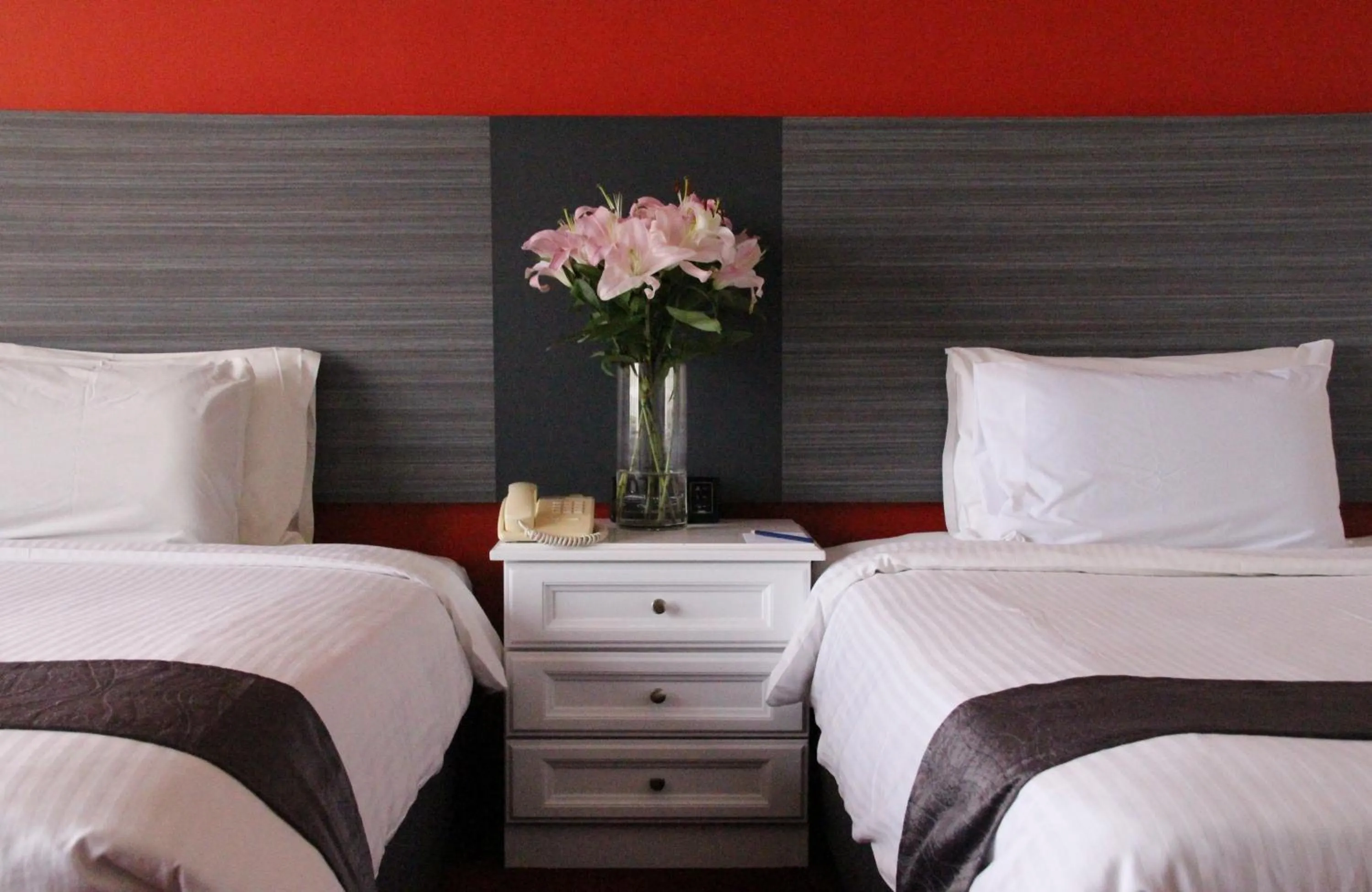 Bed in Grand Riverview Hotel