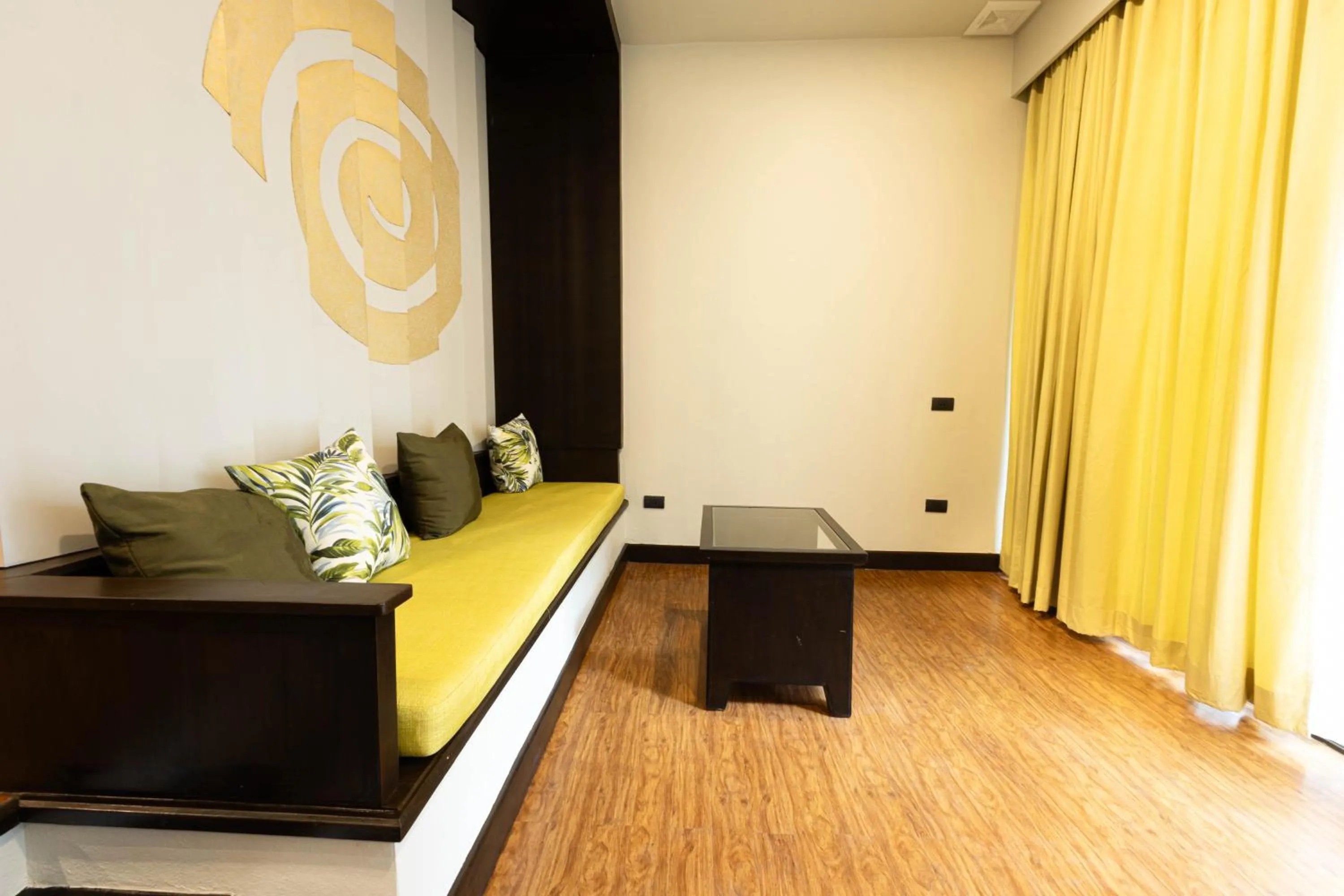 Seating area, Bed in Andaman Cannacia Resort & Spa - SHA Extra Plus